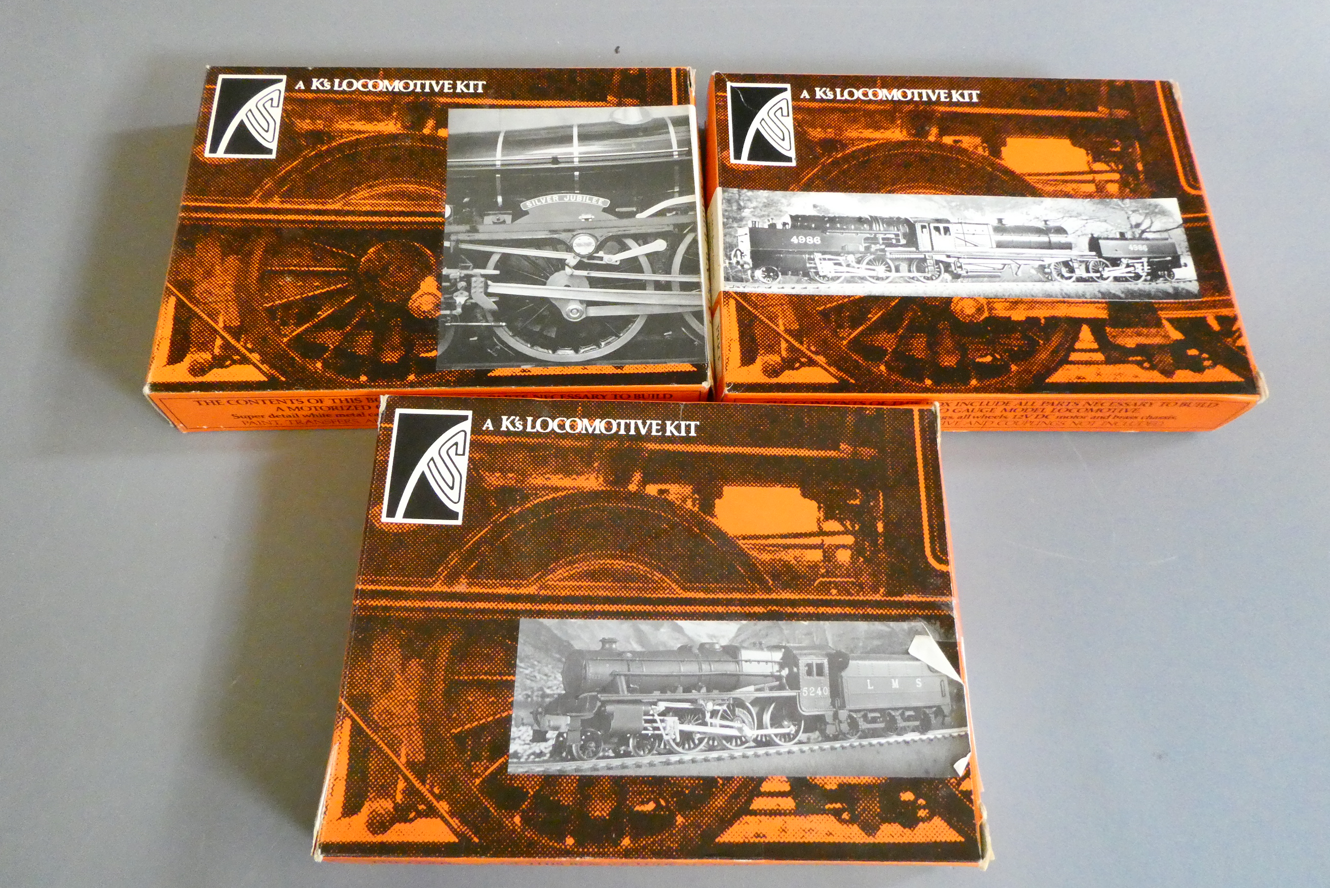Three Ks locomotive kits comprising LMS Class 5, LMS Jubilee and LMS Beyer Garratt, boxed, contents Image