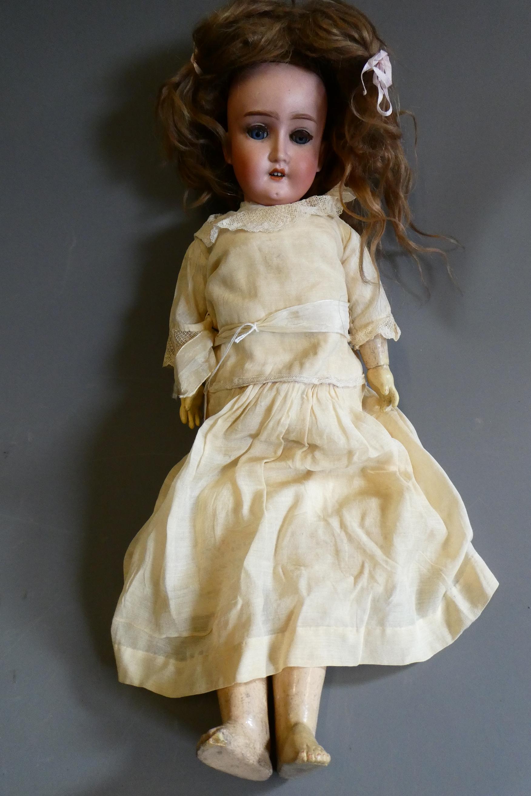 A Schoenau & Hoffmeister bisque socket head doll Image