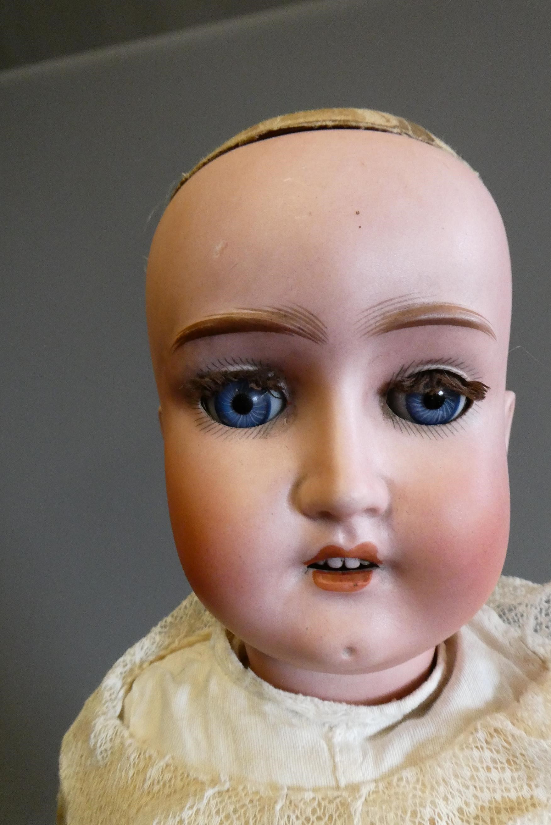 A Schoenau & Hoffmeister bisque socket head doll Image