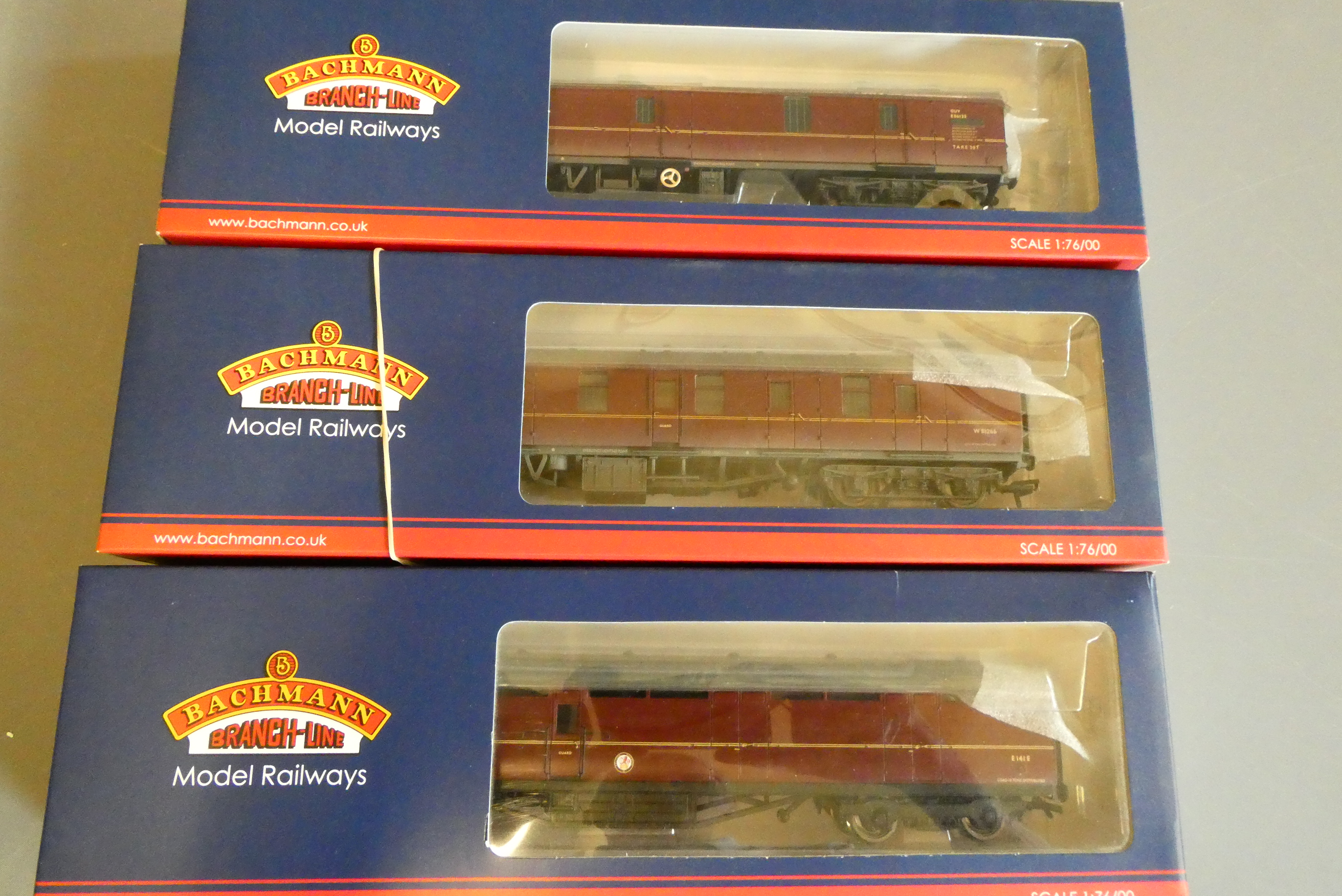 Three Bachmann British Railways MK1 crimson coaches comprising full brake, general utility van and Image