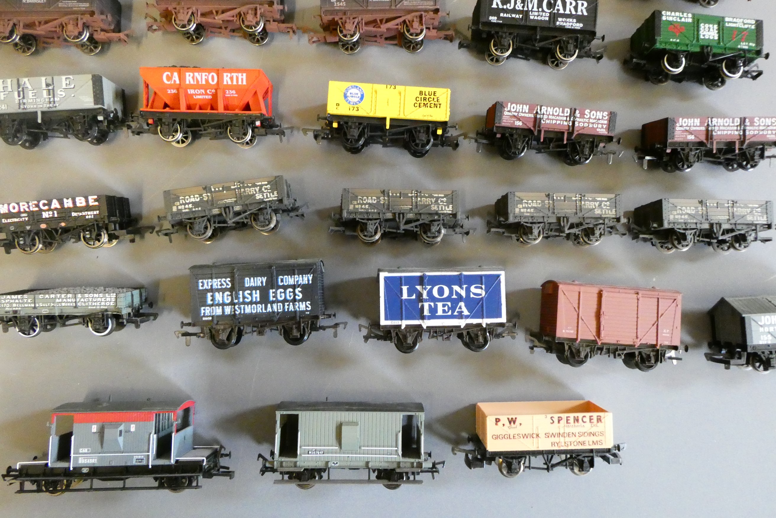 Forty unboxed goods trucks by Dapol Image