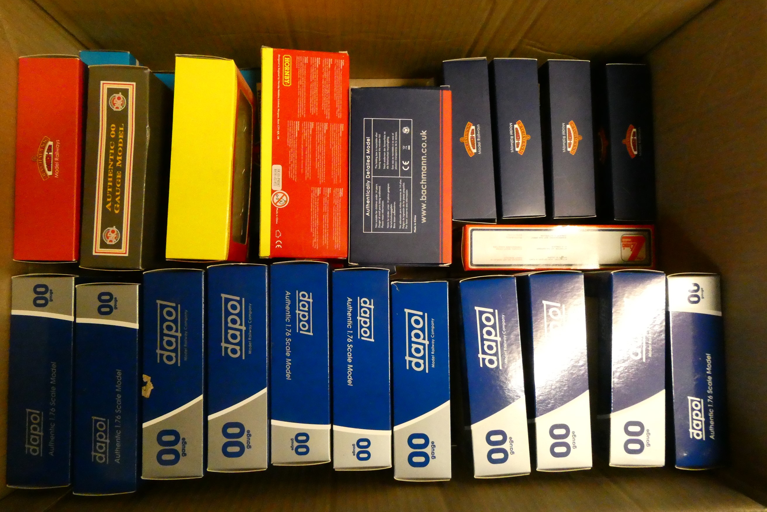 Forty unboxed goods trucks by Dapol Image