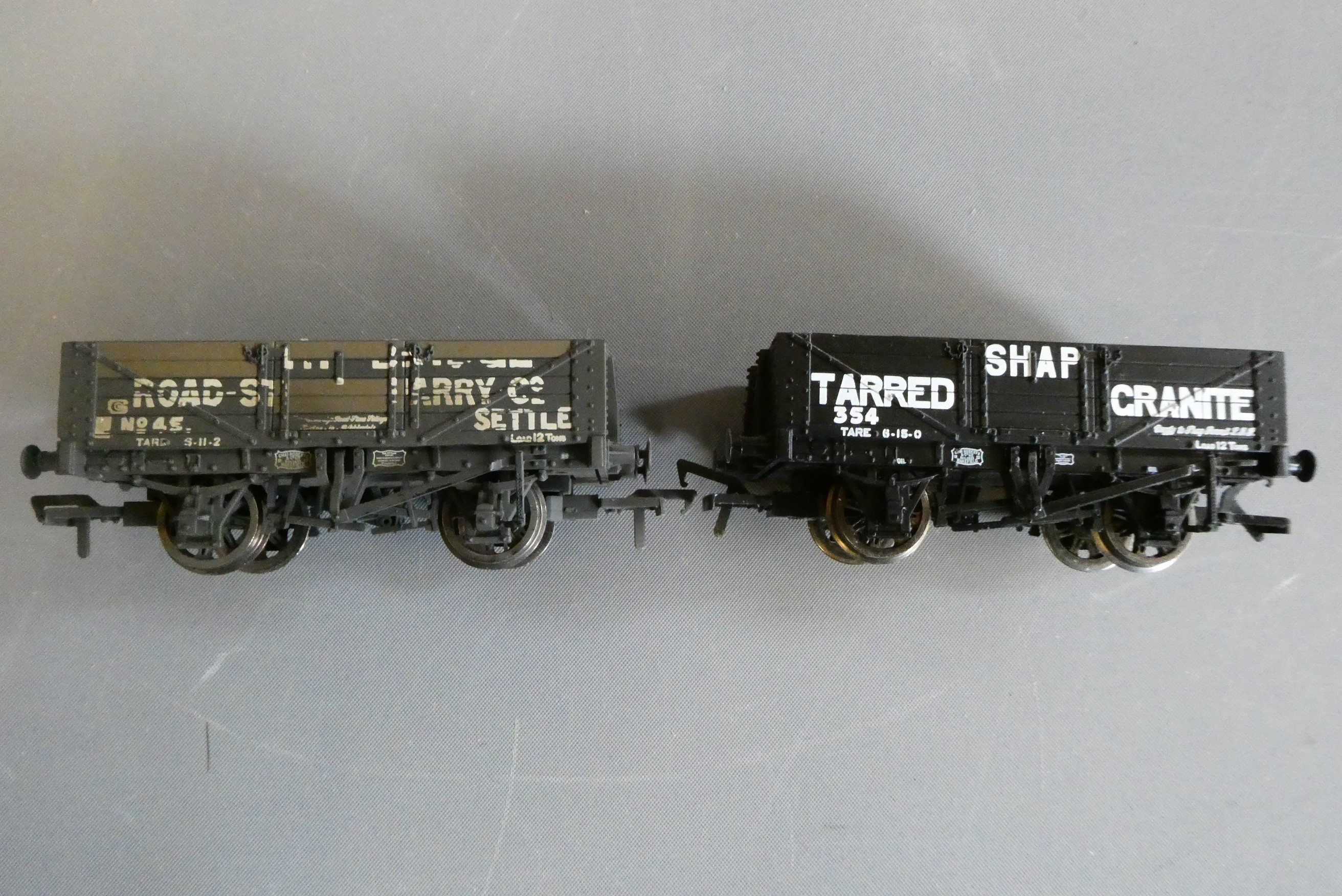 Forty unboxed goods trucks by Dapol Image