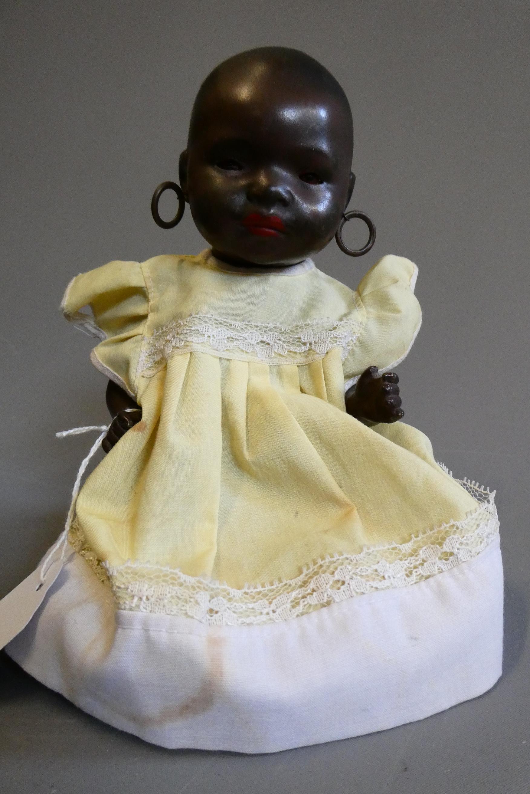 A Heubach Koppelsdorf bisque socket head doll, with brown glass fixed eyes, painted hair, earrings, Image