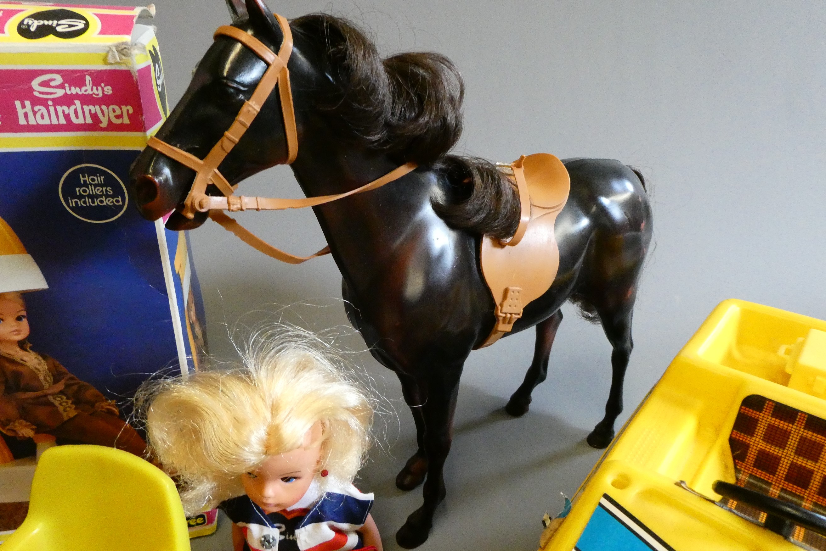 A box of Sindy doll items, including two dolls, one boxed shower, one boxed hair dryer, a horse and Image