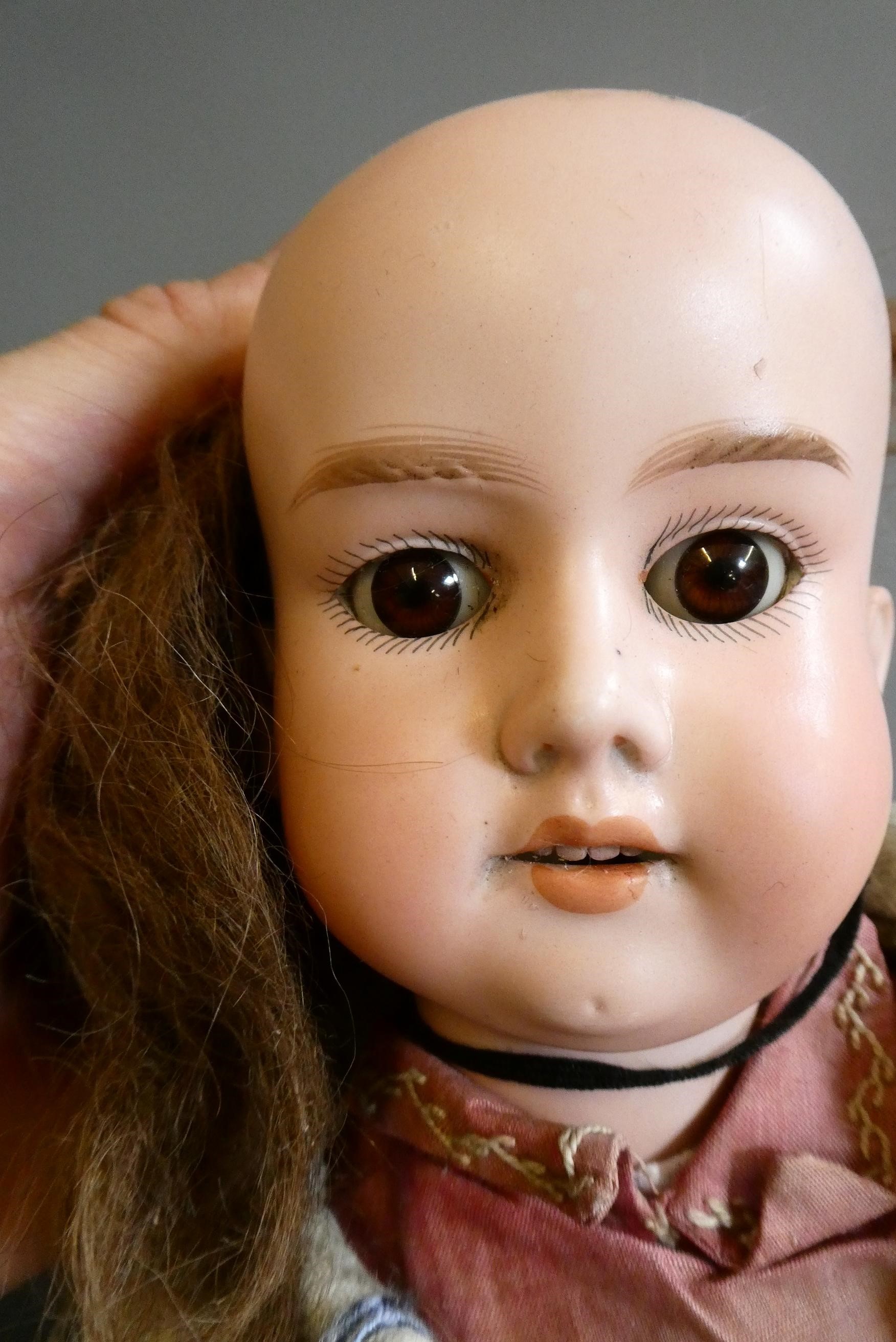 An Armand Marseille bisque socket head doll Image