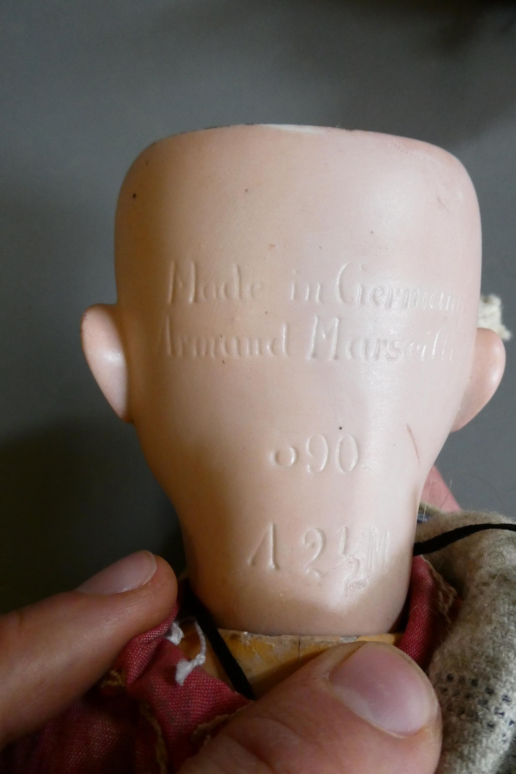 An Armand Marseille bisque socket head doll Image