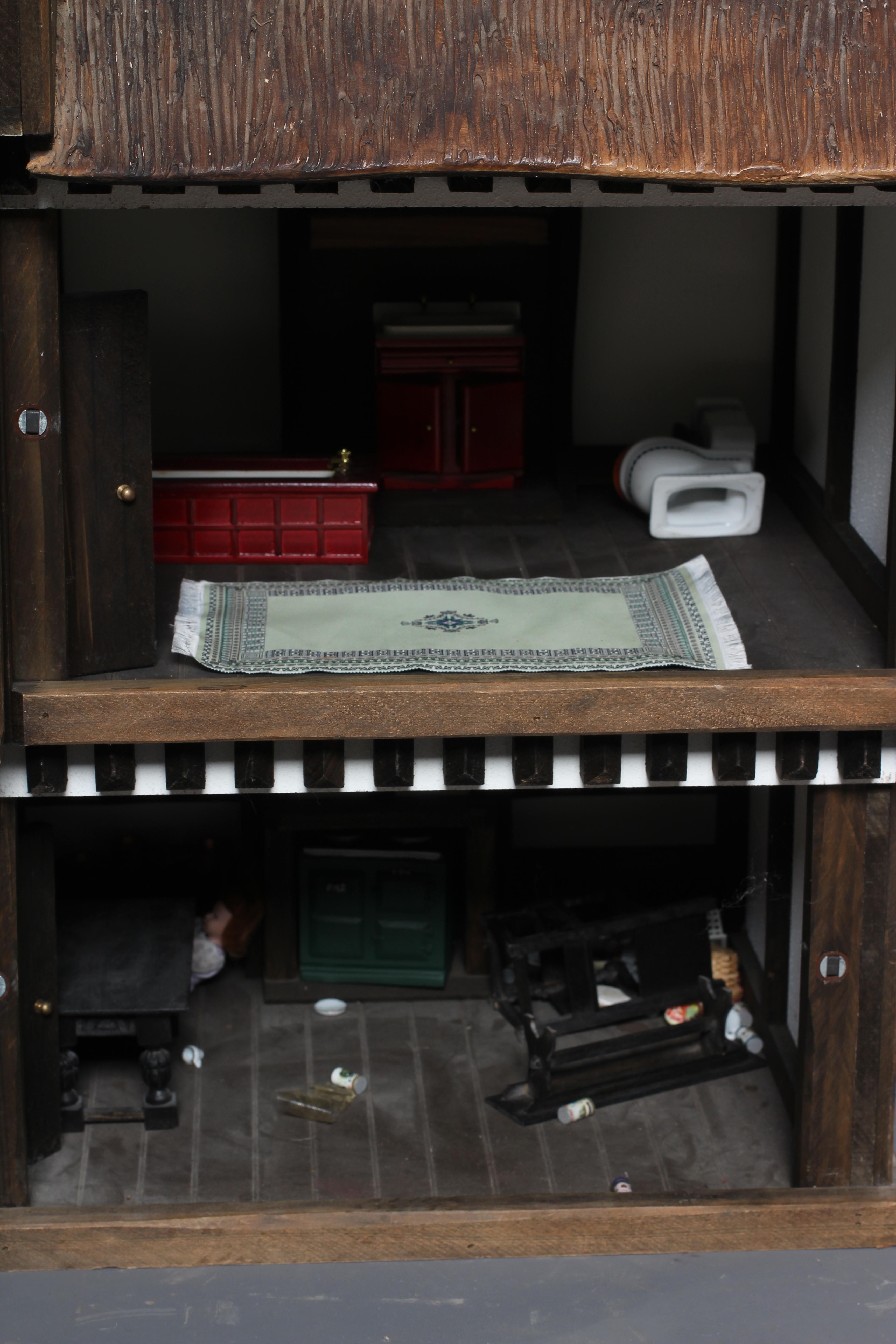 A large Tudor style doll's house Image