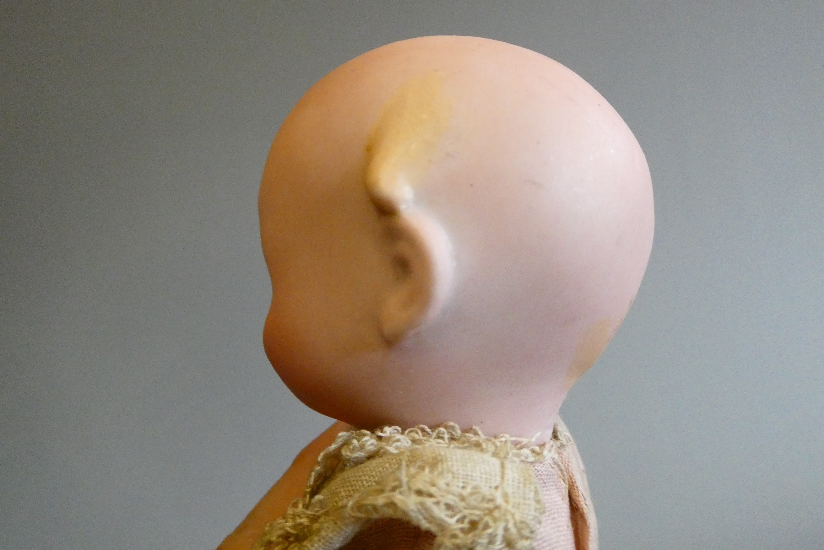 A bisque socket head googly eyed character doll Image