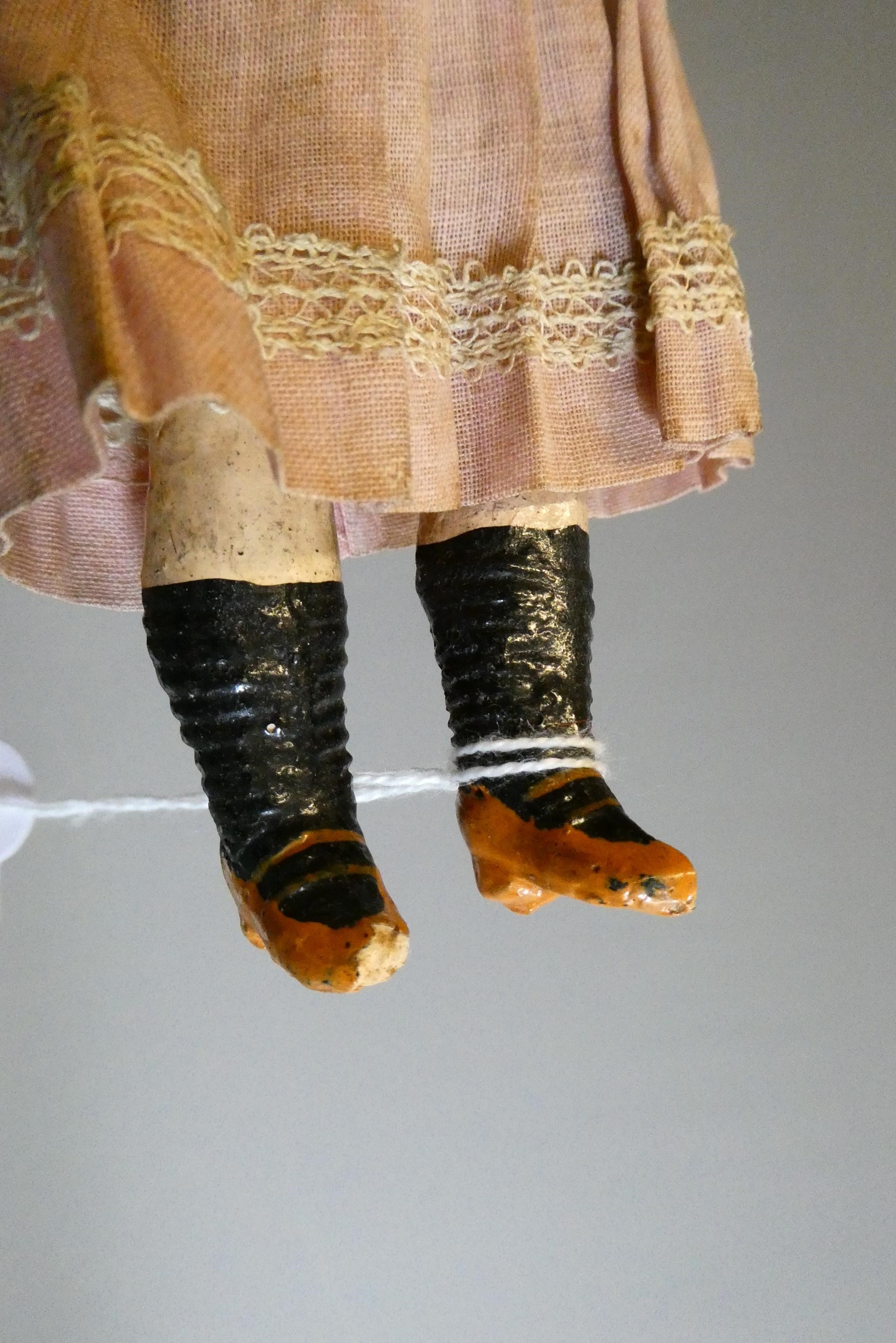 A bisque socket head googly eyed character doll Image