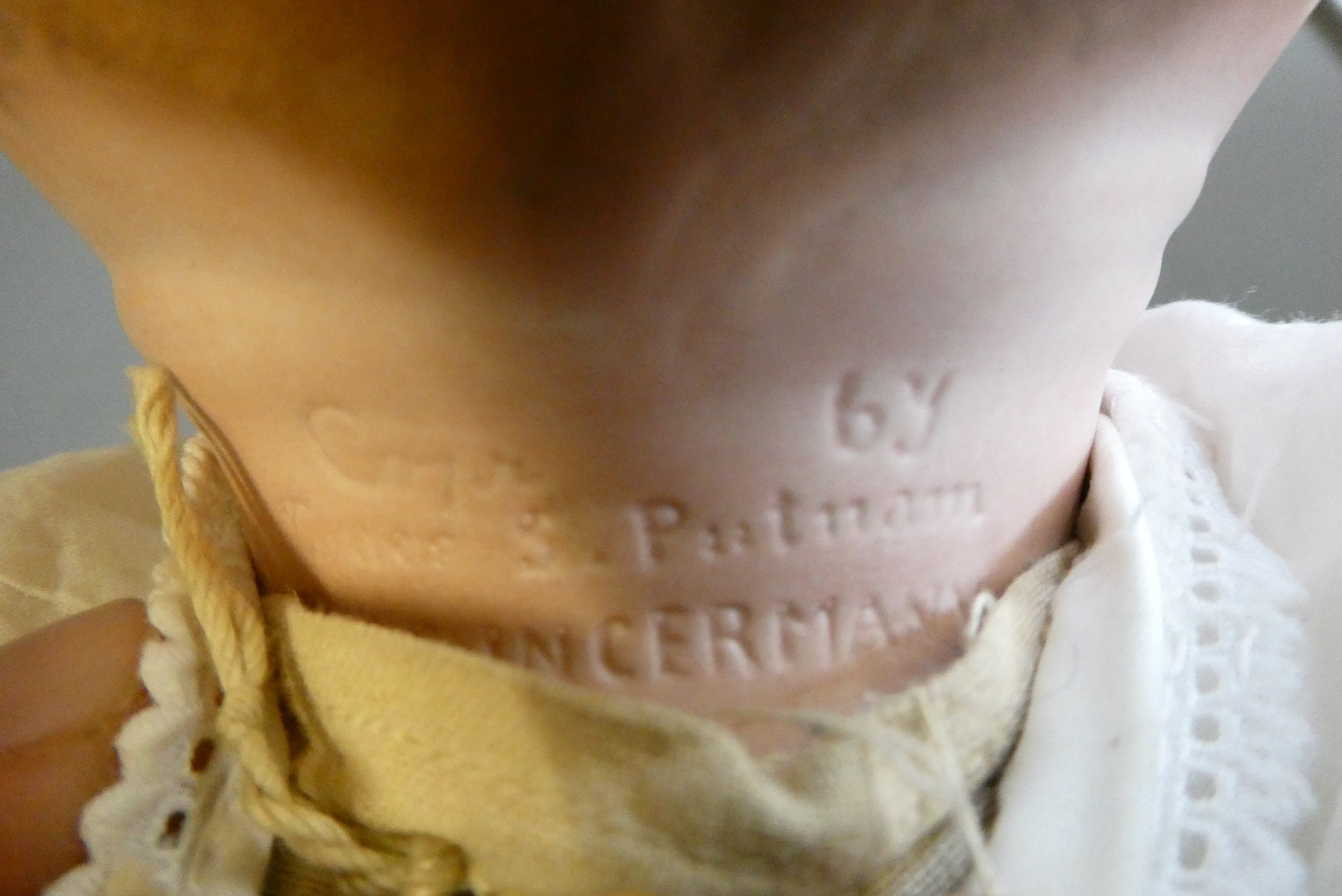 A Grace Putnam flange neck baby doll, with blue glass sleeping eyes, closed mouth, moulded and Image