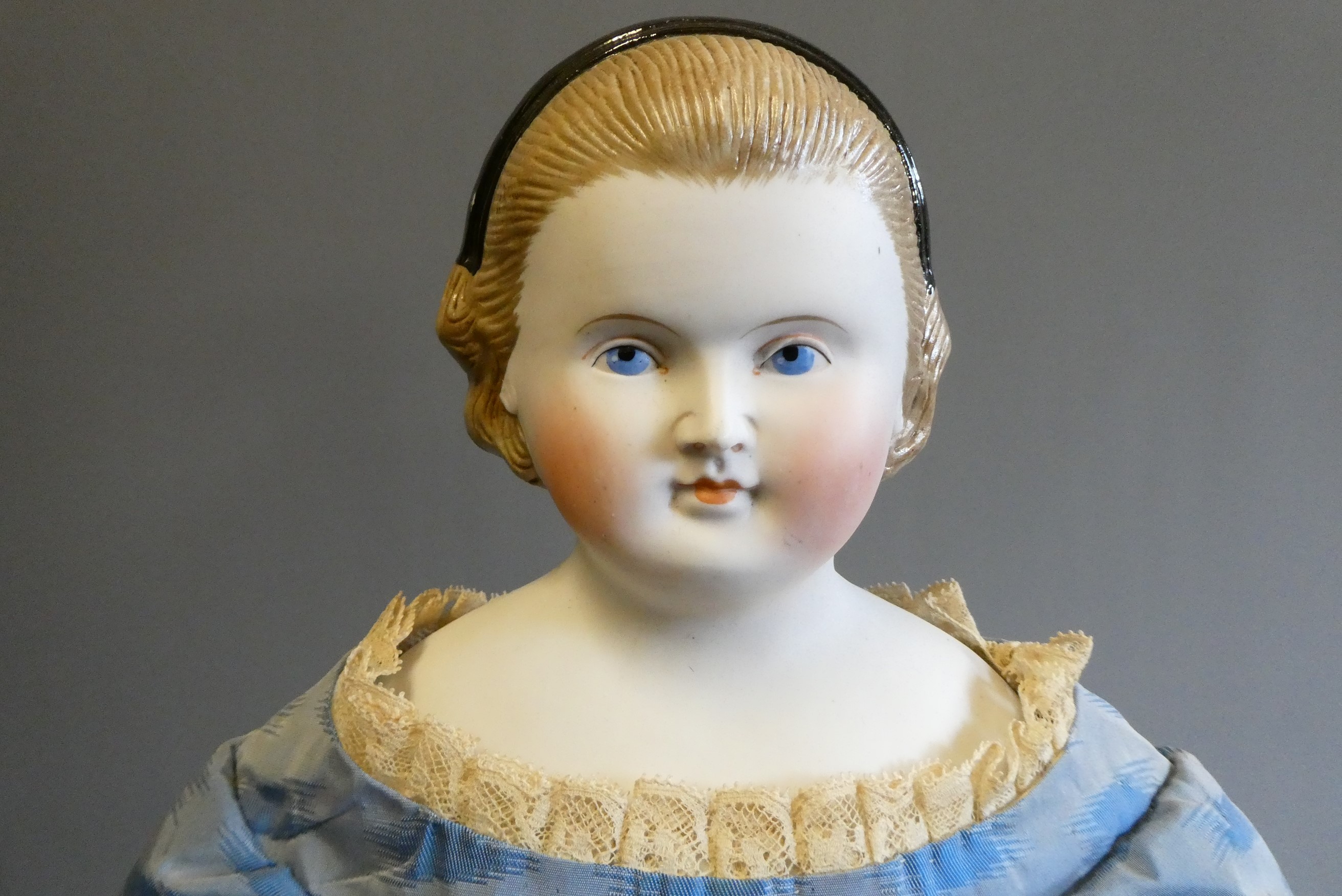 A Victorian bisque shoulder head doll Image