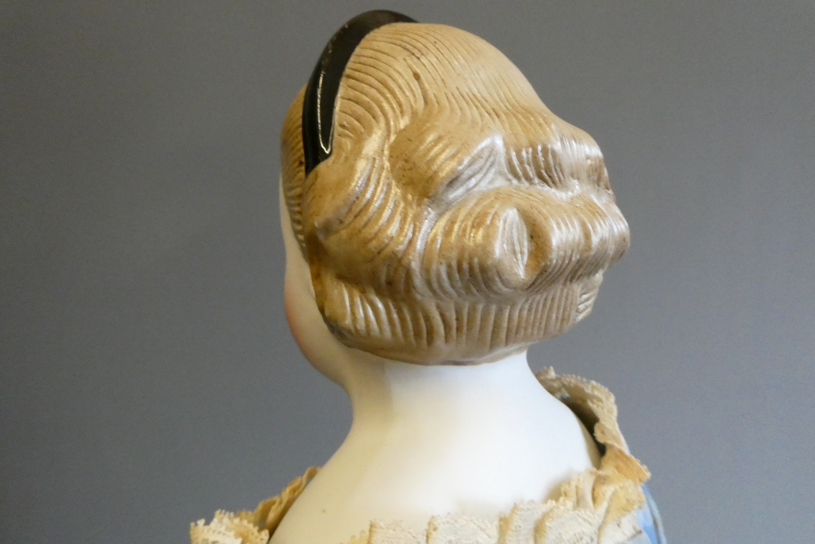 A Victorian bisque shoulder head doll Image