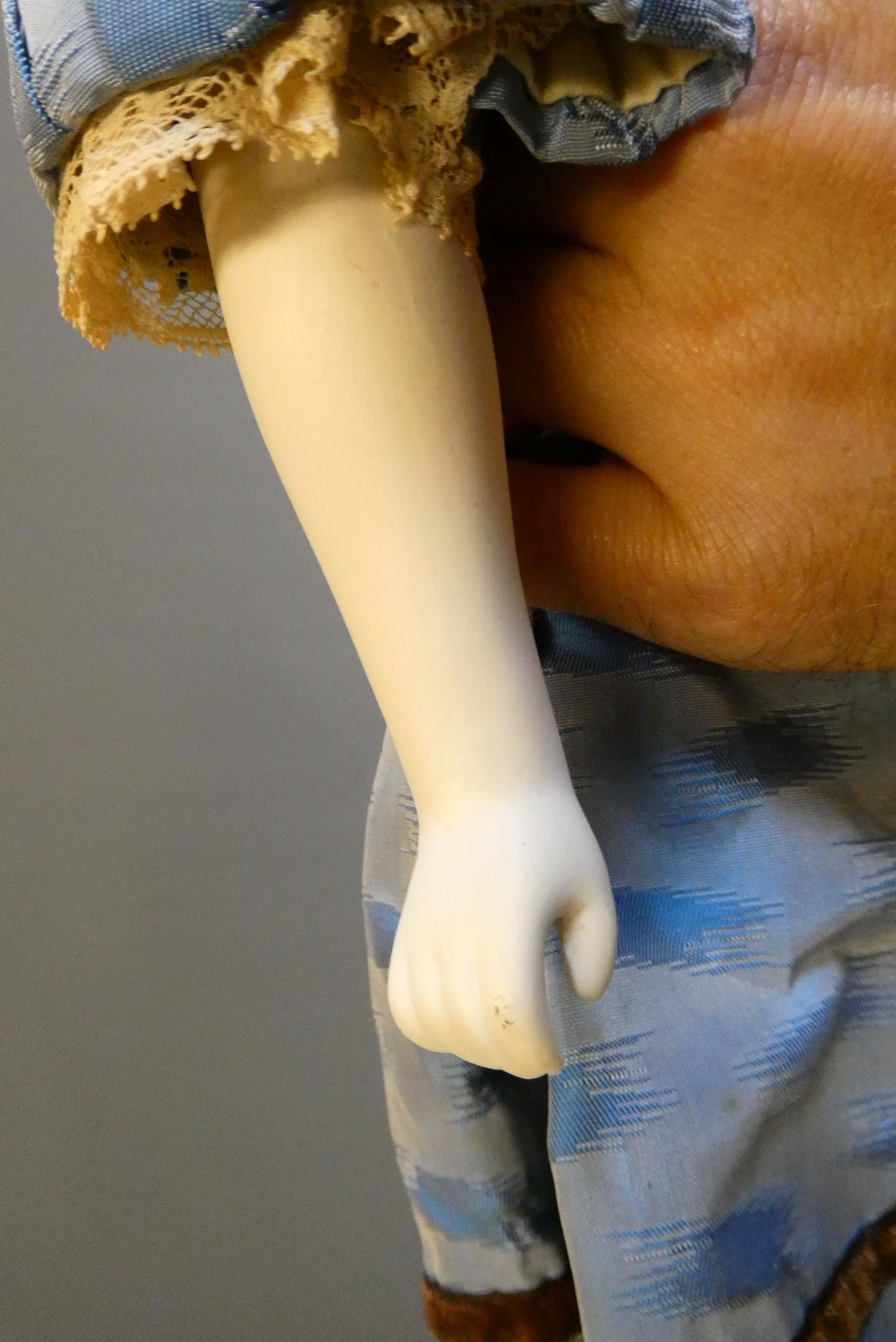 A Victorian bisque shoulder head doll Image