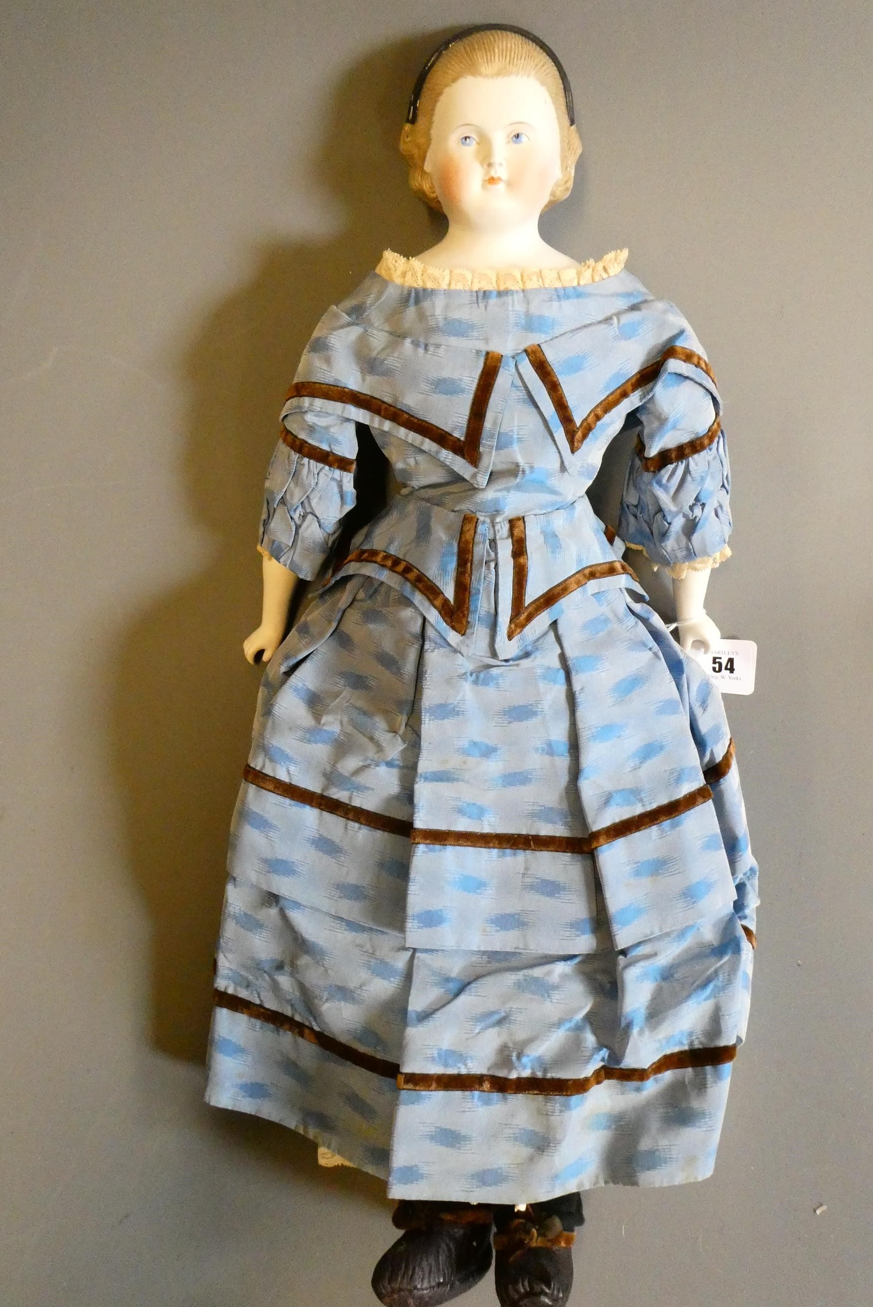 A Victorian bisque shoulder head doll Image