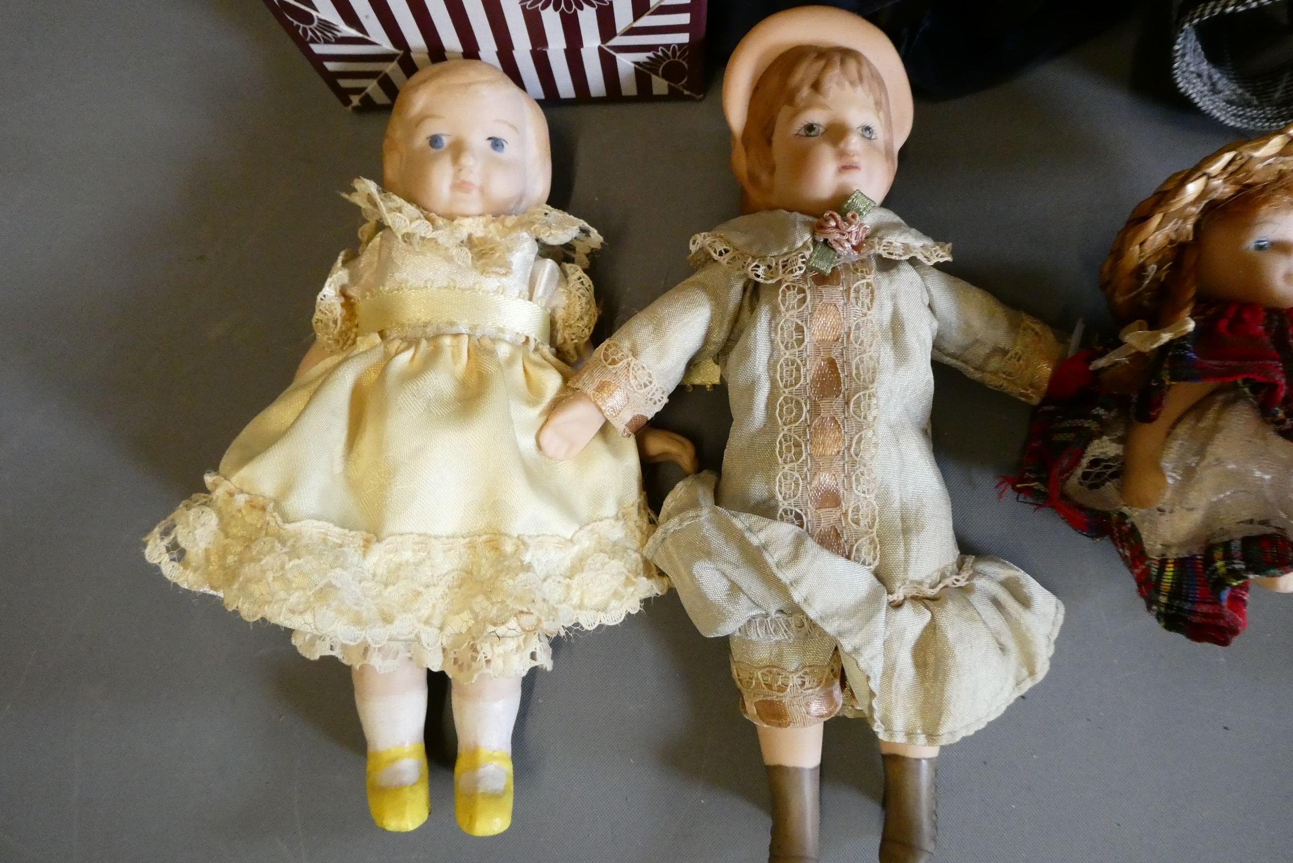 Eight doll's house dolls, seven of which all bisque, and one with fabric body, one boxed and all in Image