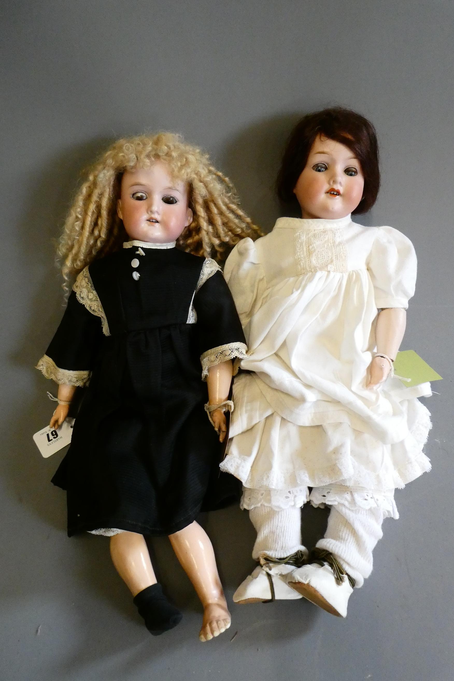 Two Armand Marseille bisque socket head dolls Image