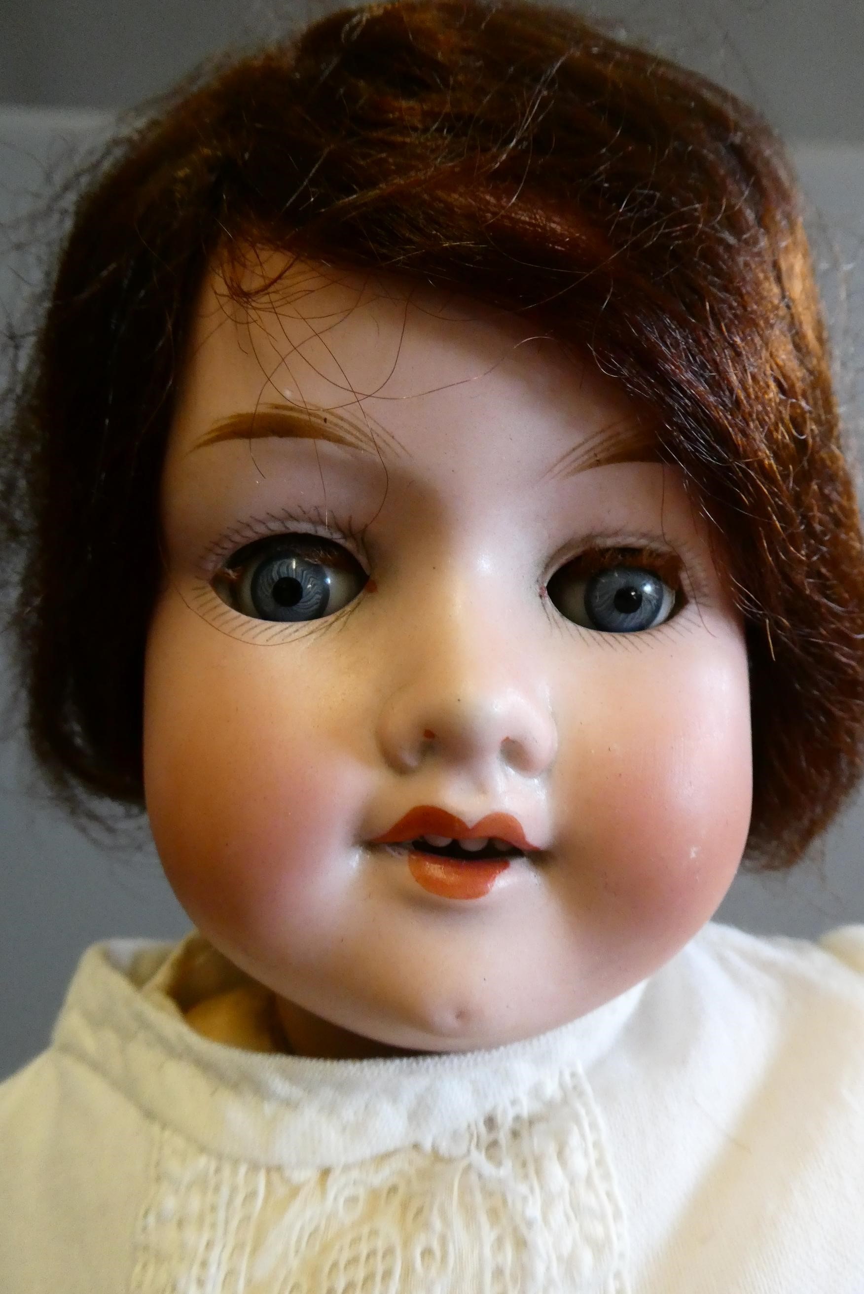 Two Armand Marseille bisque socket head dolls Image