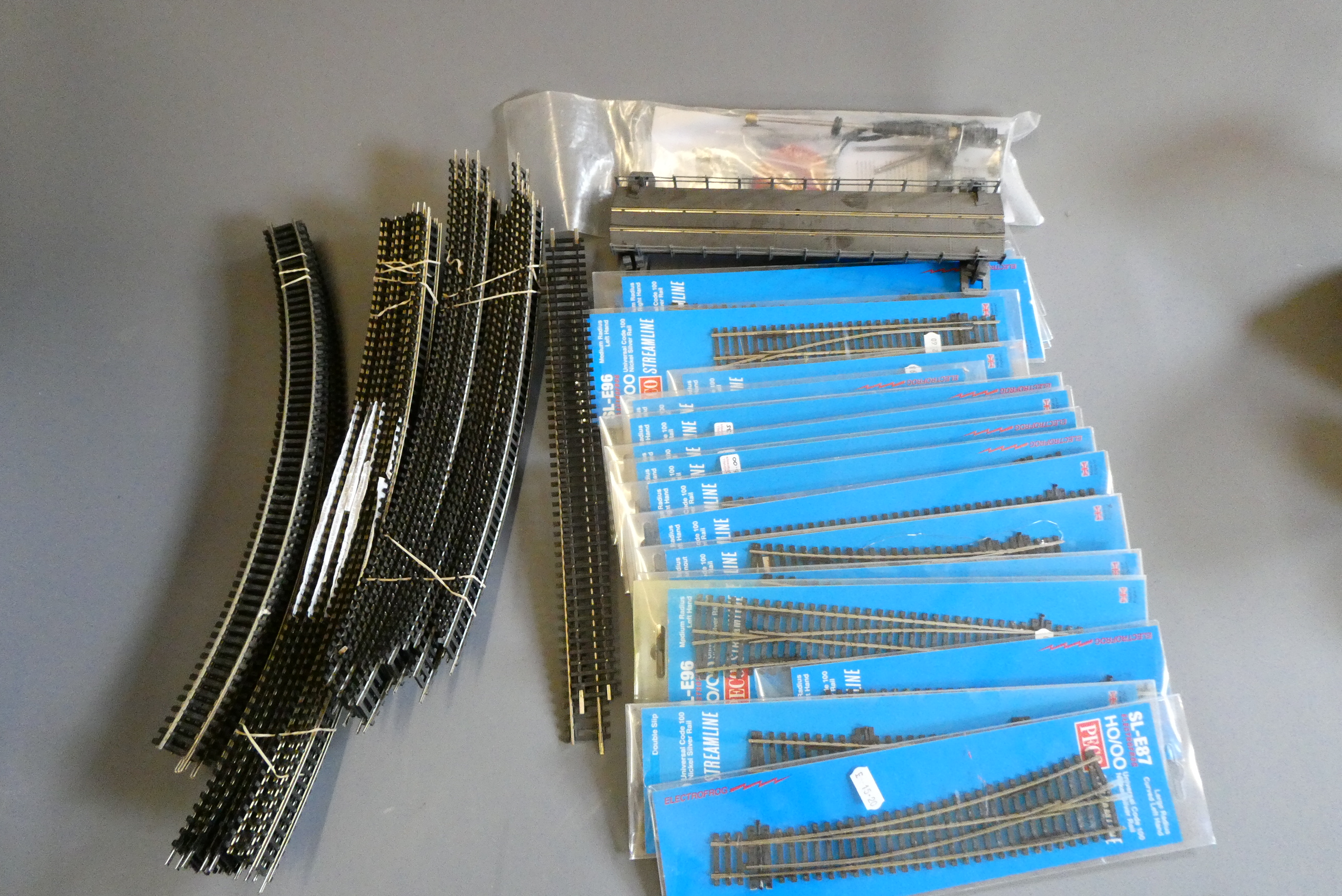 Peco track and electro frog points, most items boxed and unused, and a small quantity of trackside Image