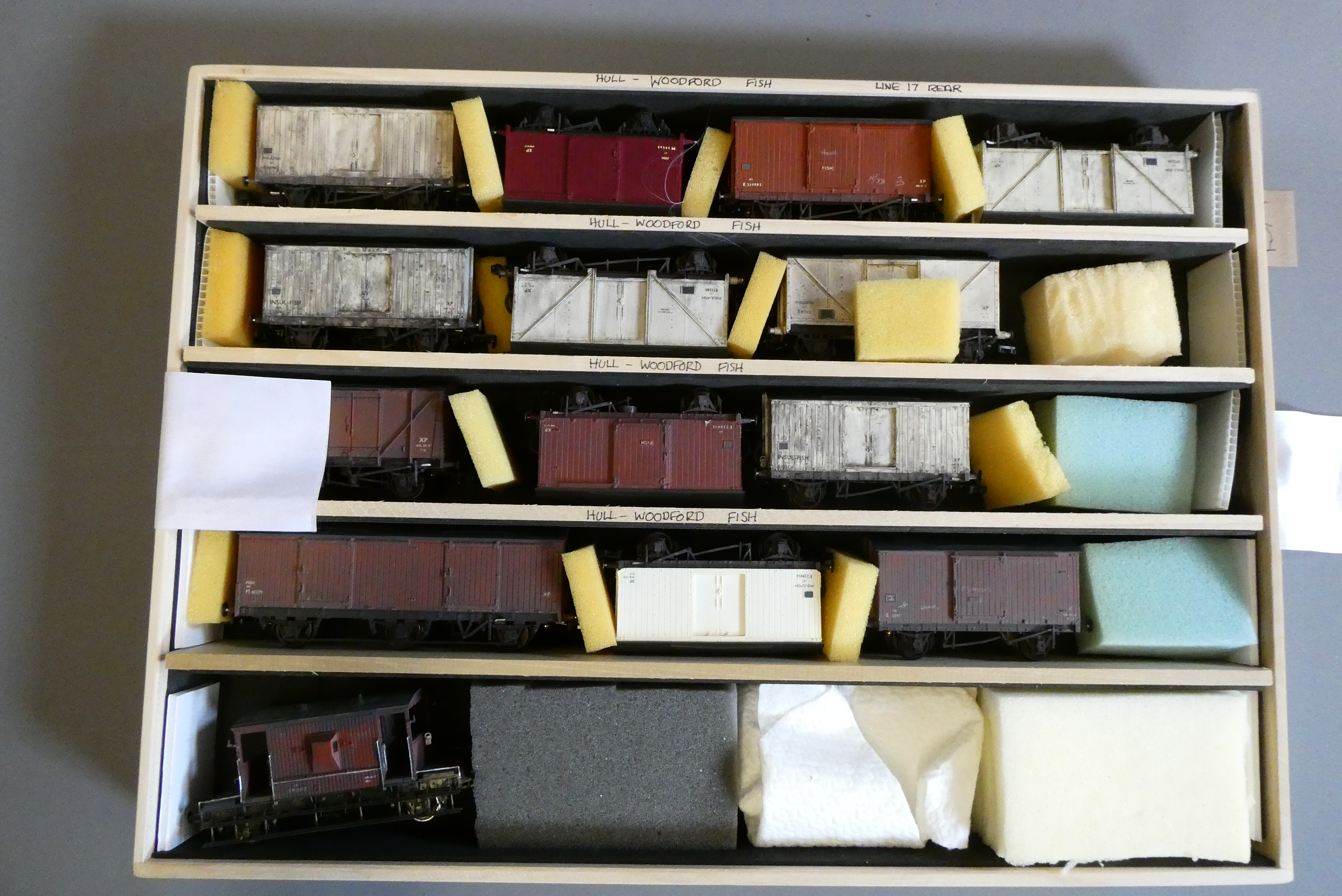 Thirteen fish vans and brake van, all items have been weathered, good (Est. plus 24% premium inc. Image