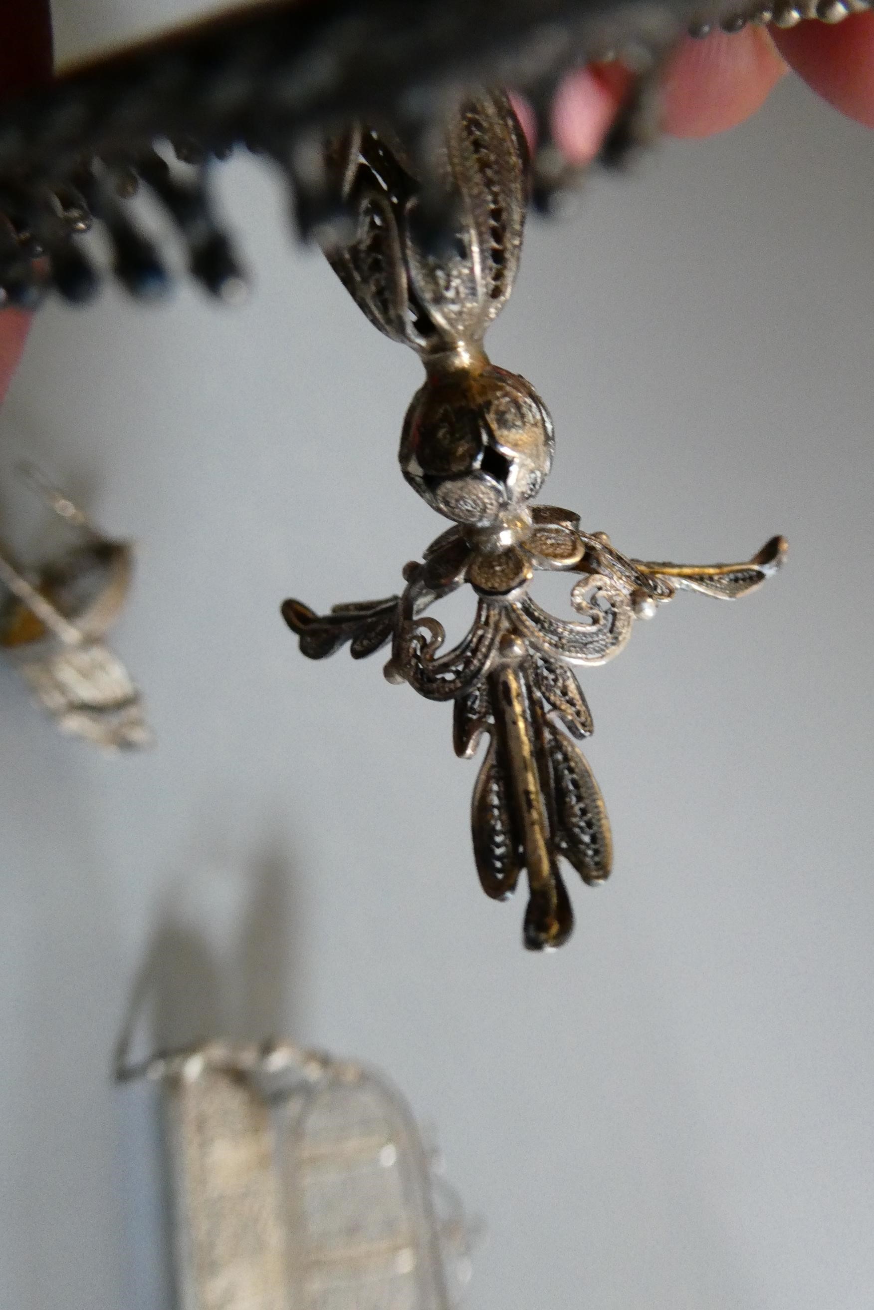 Antique filigree white metal doll's house furniture comprising two chairs, a settee and a pedestal Image