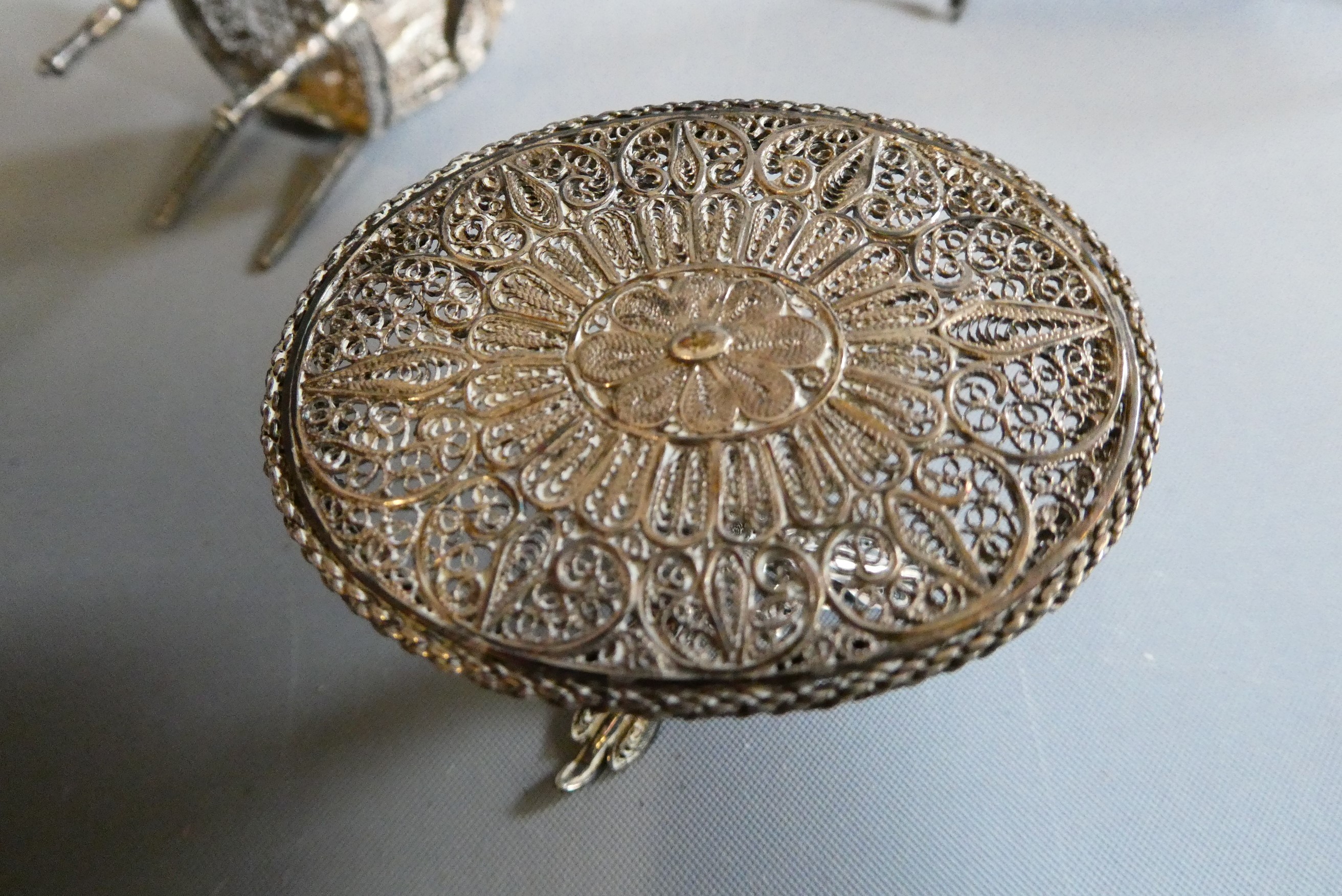 Antique filigree white metal doll's house furniture comprising two chairs, a settee and a pedestal Image