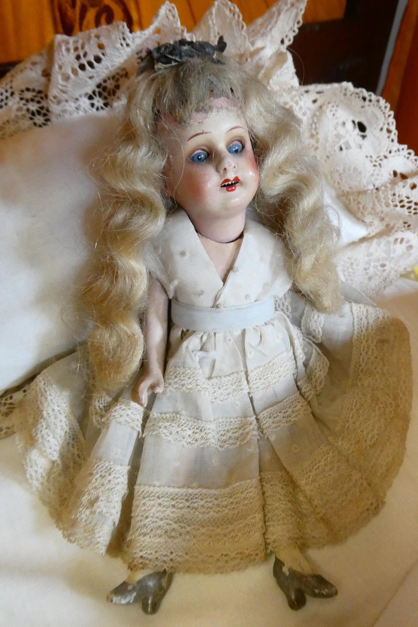 A mahogany half tester doll's bed Image