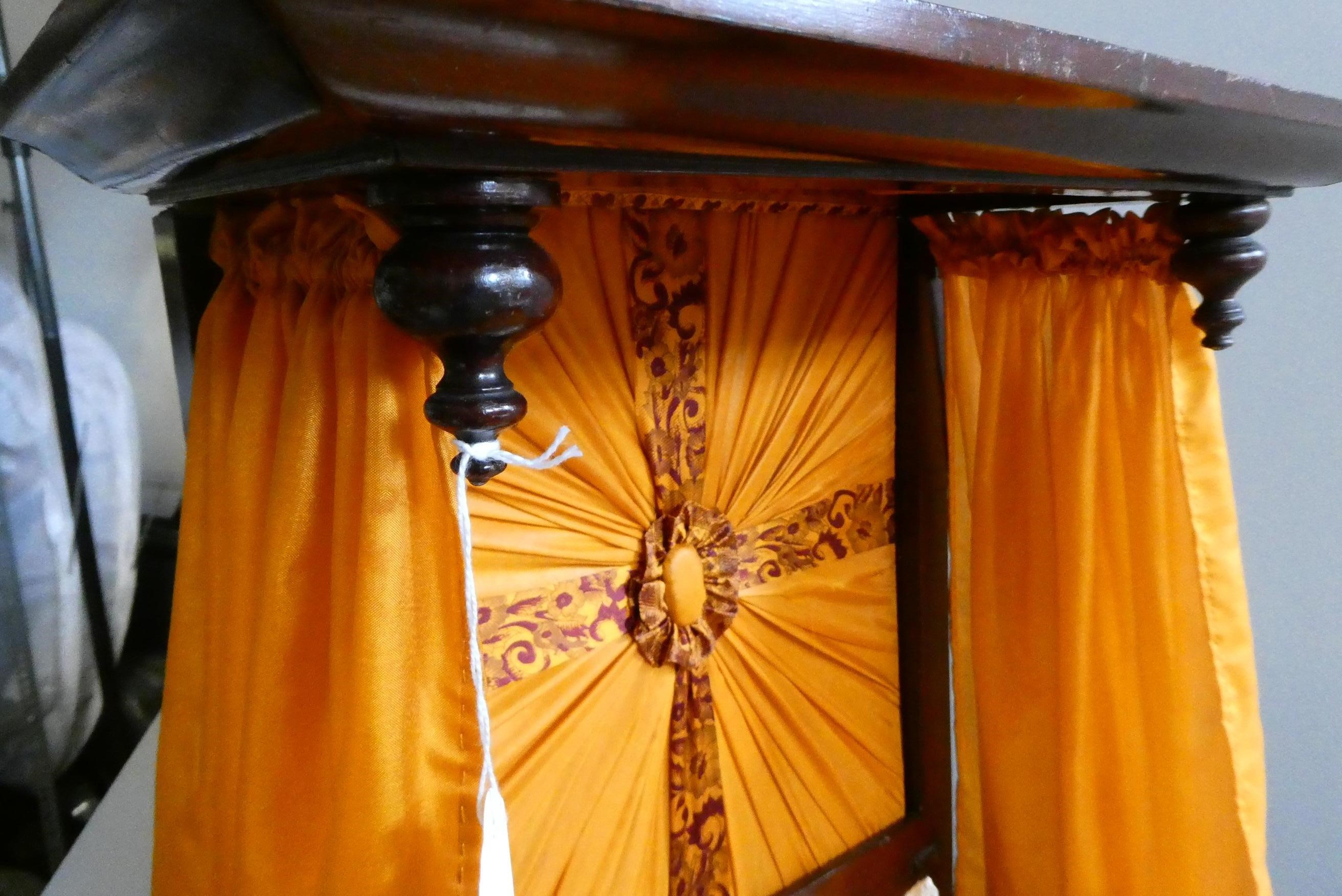 A mahogany half tester doll's bed Image