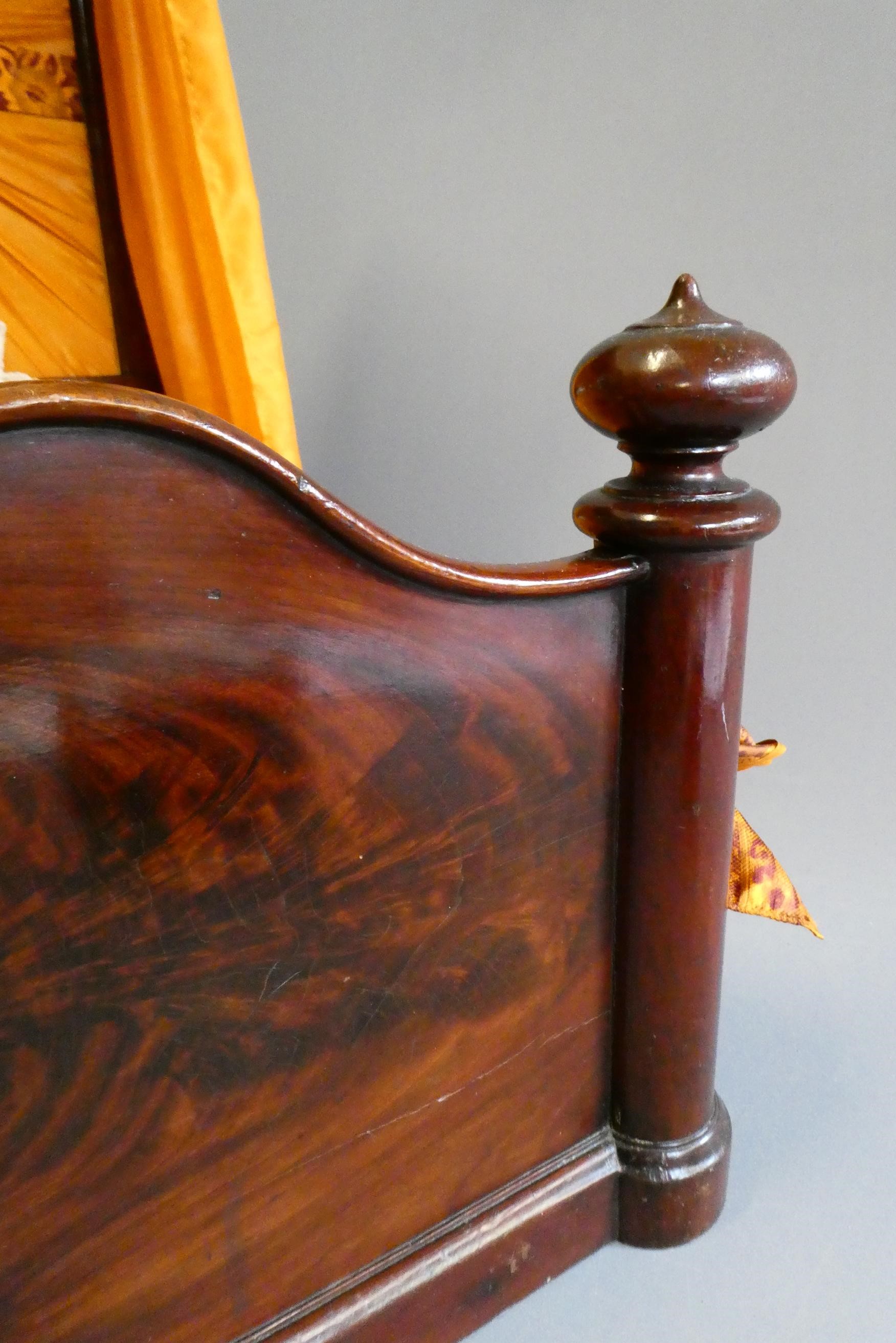 A mahogany half tester doll's bed Image