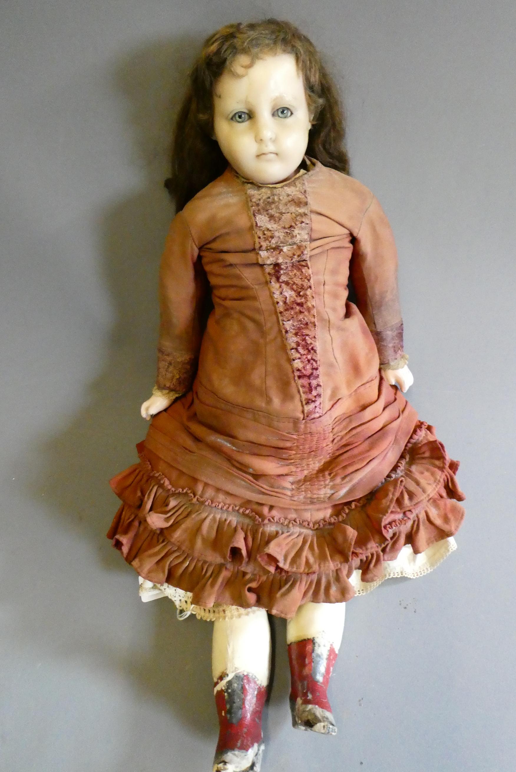 A Victorian wax shoulder head doll Image