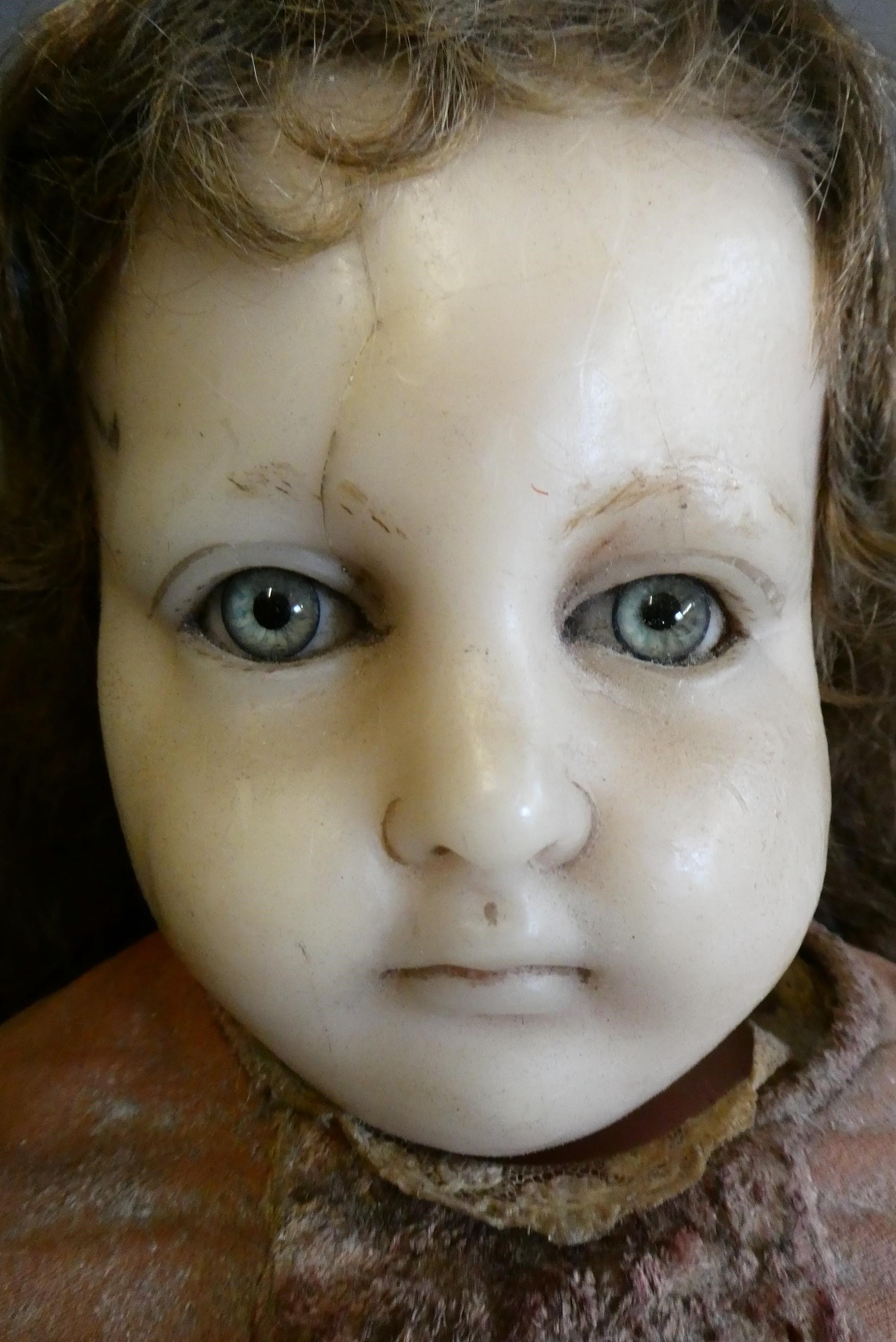 A Victorian wax shoulder head doll Image