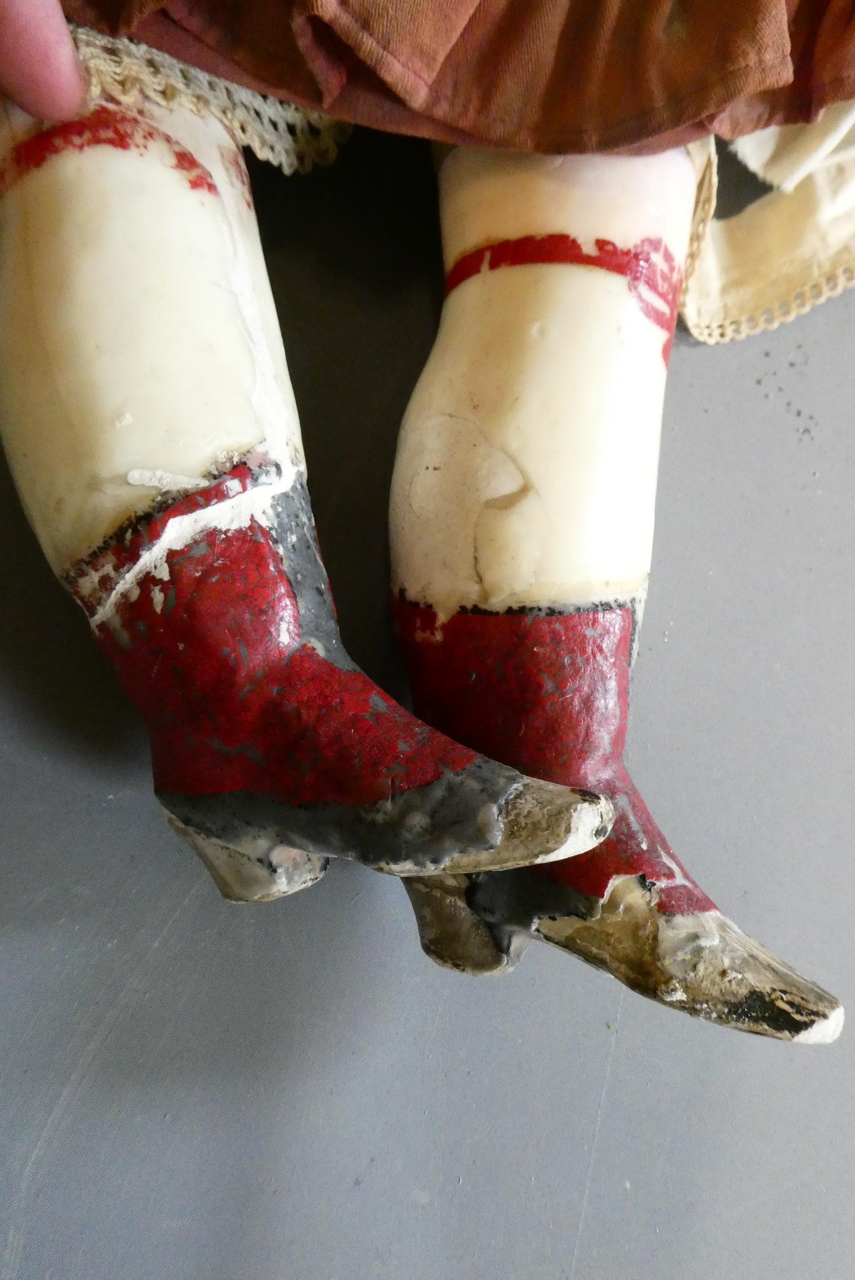 A Victorian wax shoulder head doll Image