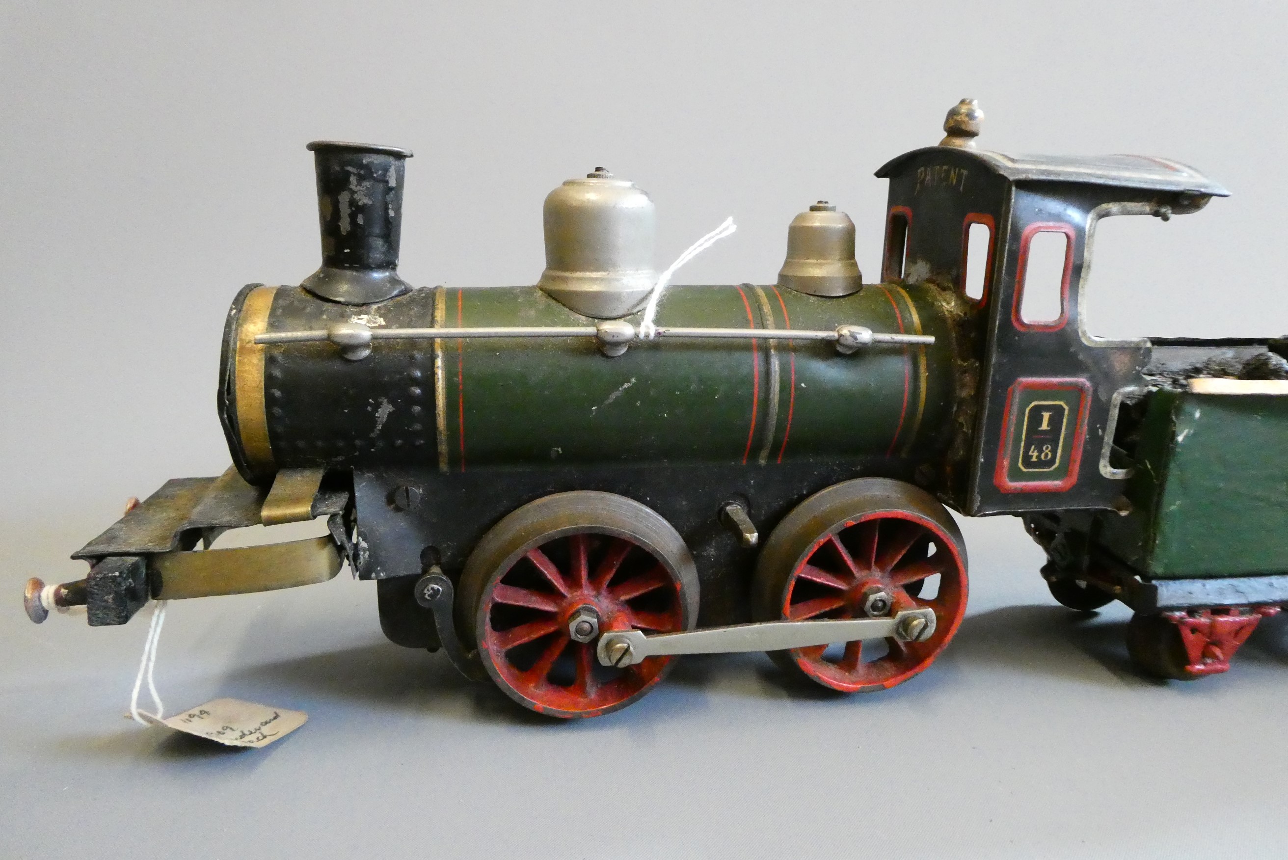 Bing gauge 1 clockwork locomotive and tender, some damage and parts missing, fair to poor (Est. plus Image