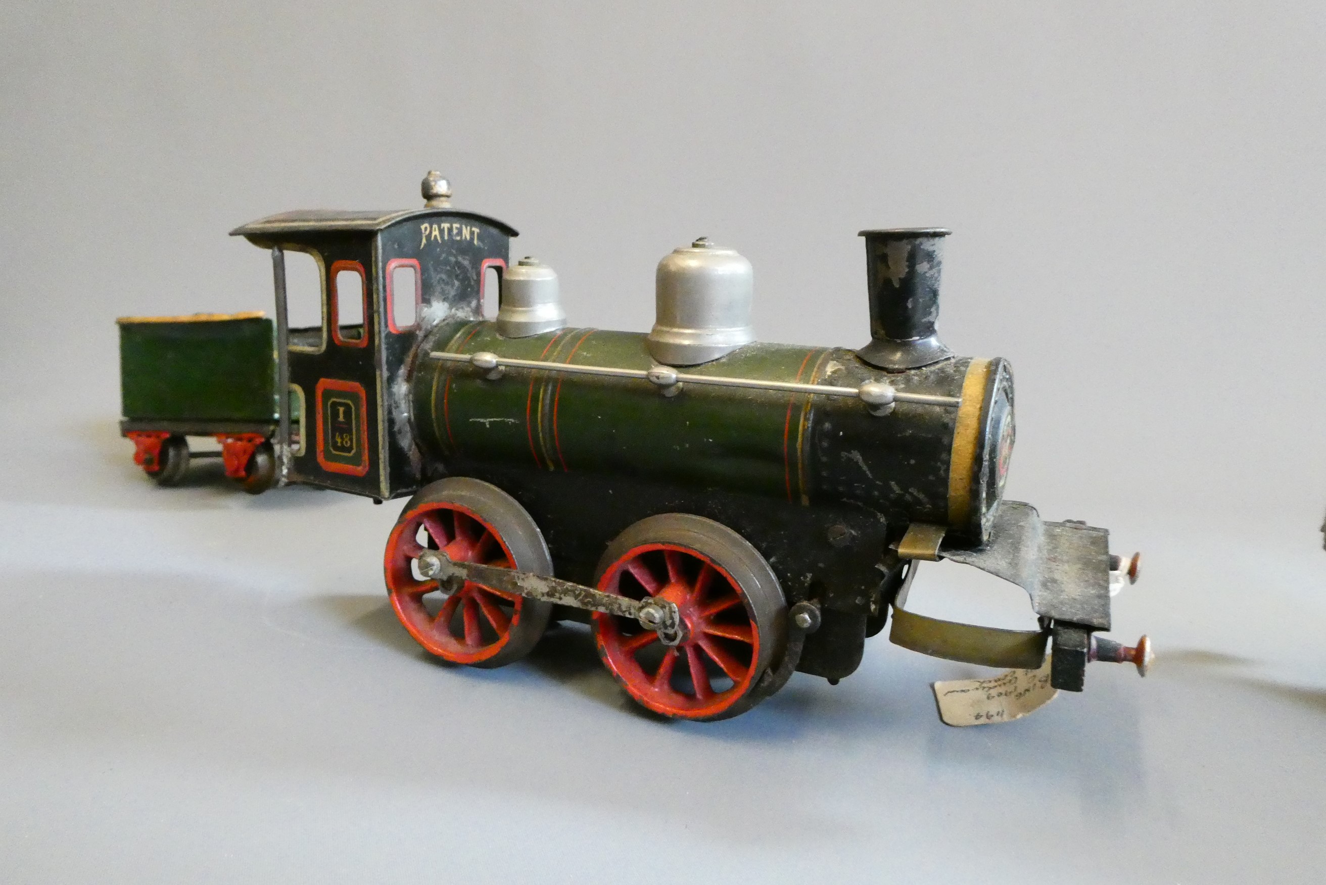 Bing gauge 1 clockwork locomotive and tender, some damage and parts missing, fair to poor (Est. plus Image