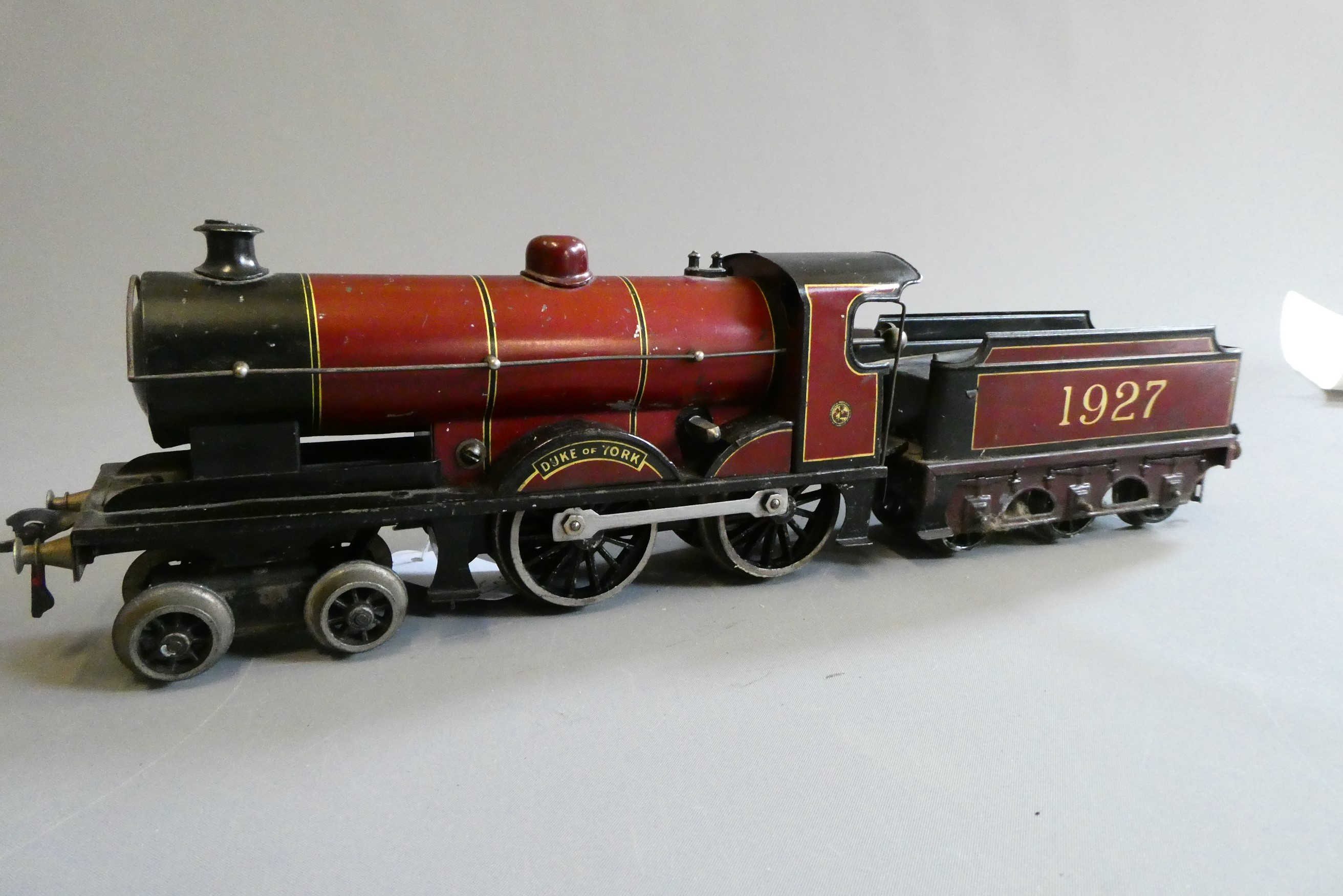 Basset-Lowke Clockwork Duke of York locomotive and tender. Some minor paint scratches, fair to good Image