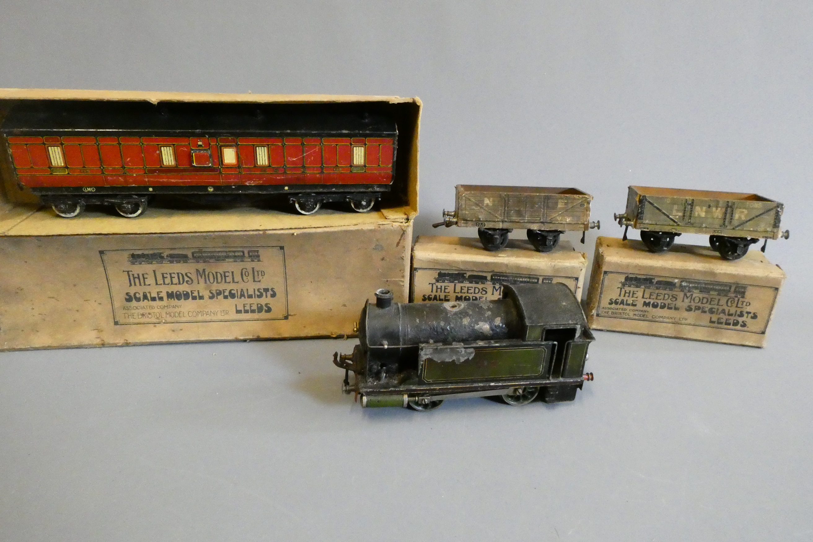 Playworn 0 gauge trains comprising Bing 112 steam LNER Tank locomotive, two Leeds wagons, Leeds Image