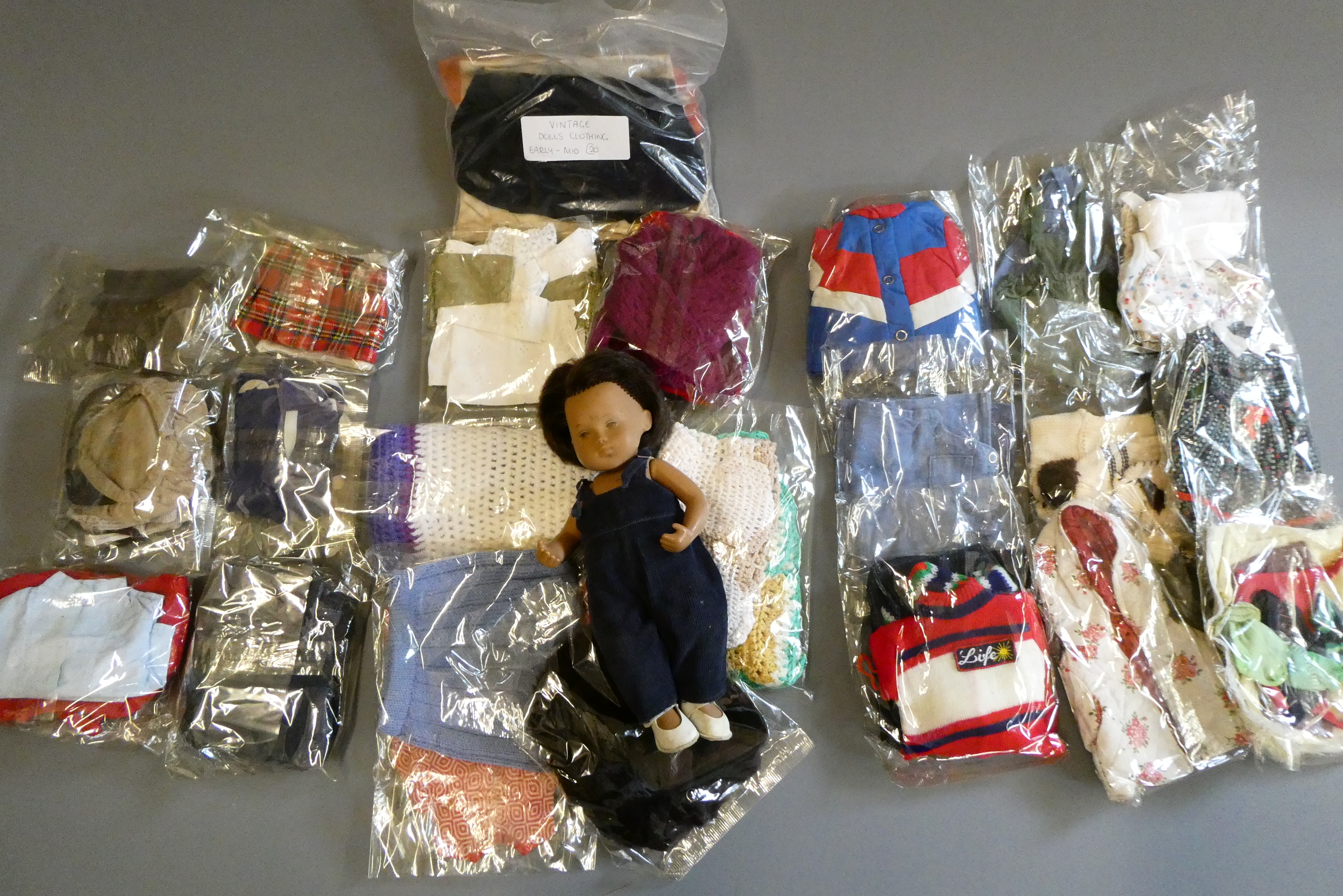 Sasha doll, with a bag of original 1970s Sasha clothing and other clothing to fit Sasha Image
