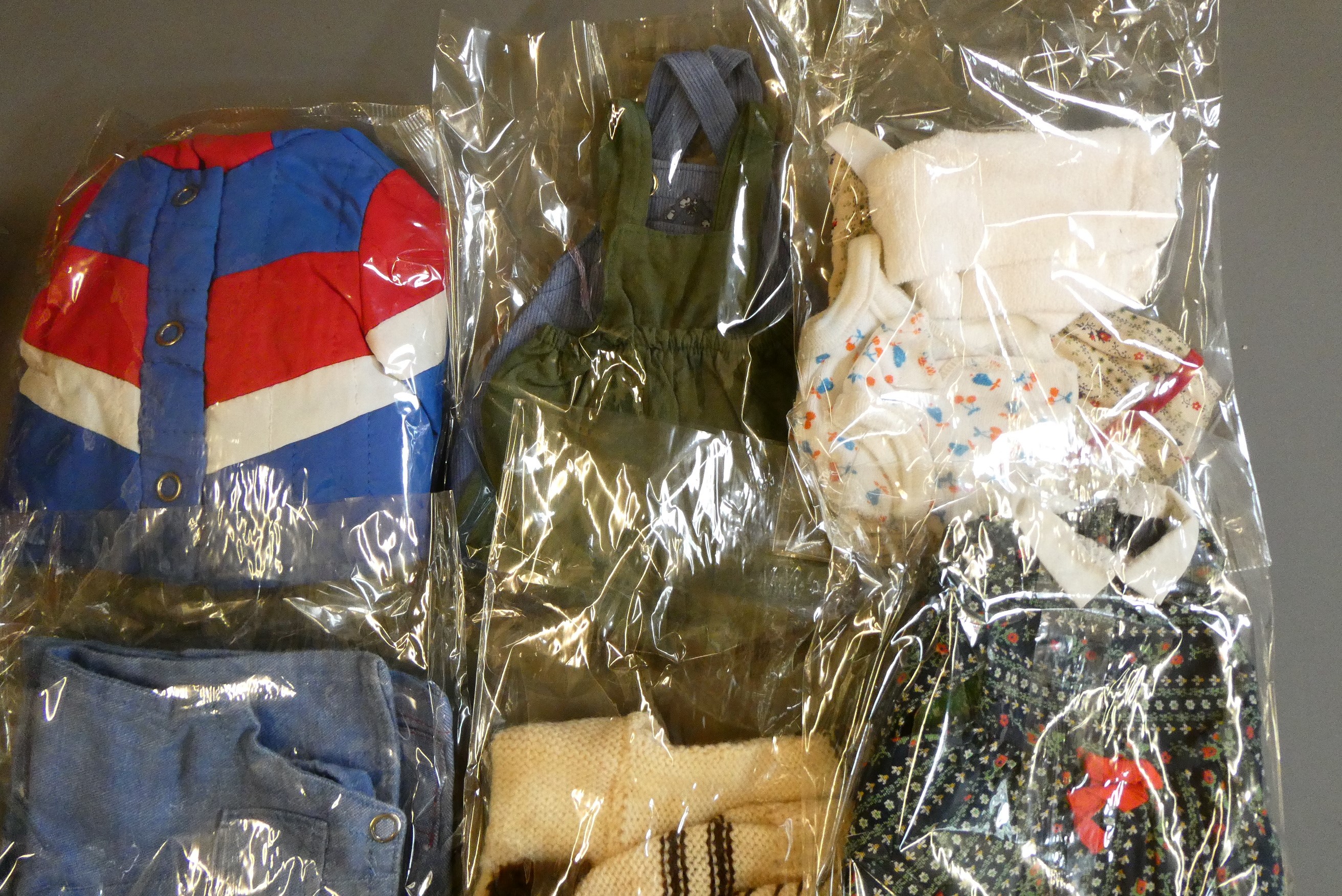 Sasha doll, with a bag of original 1970s Sasha clothing and other clothing to fit Sasha Image