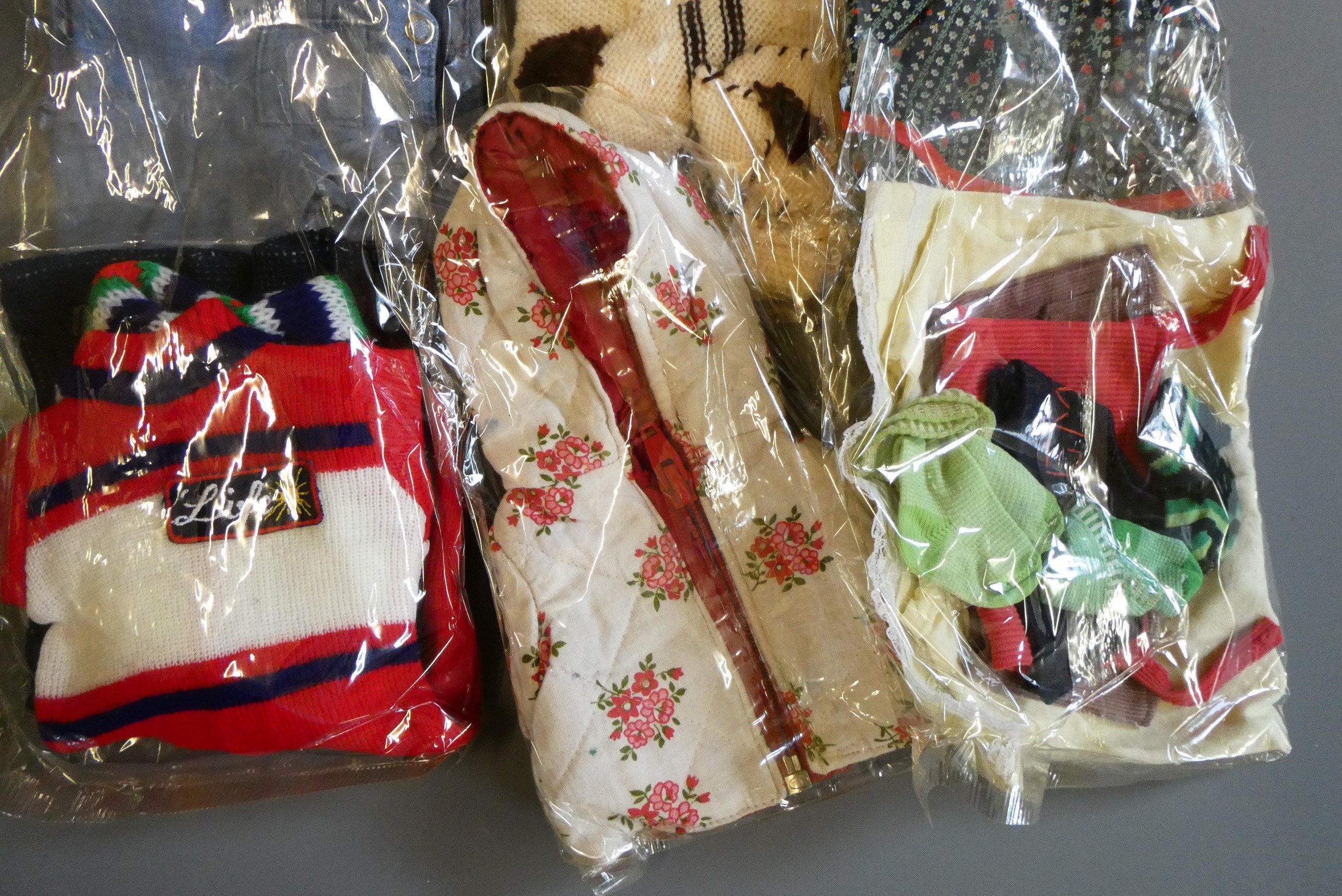 Sasha doll, with a bag of original 1970s Sasha clothing and other clothing to fit Sasha Image