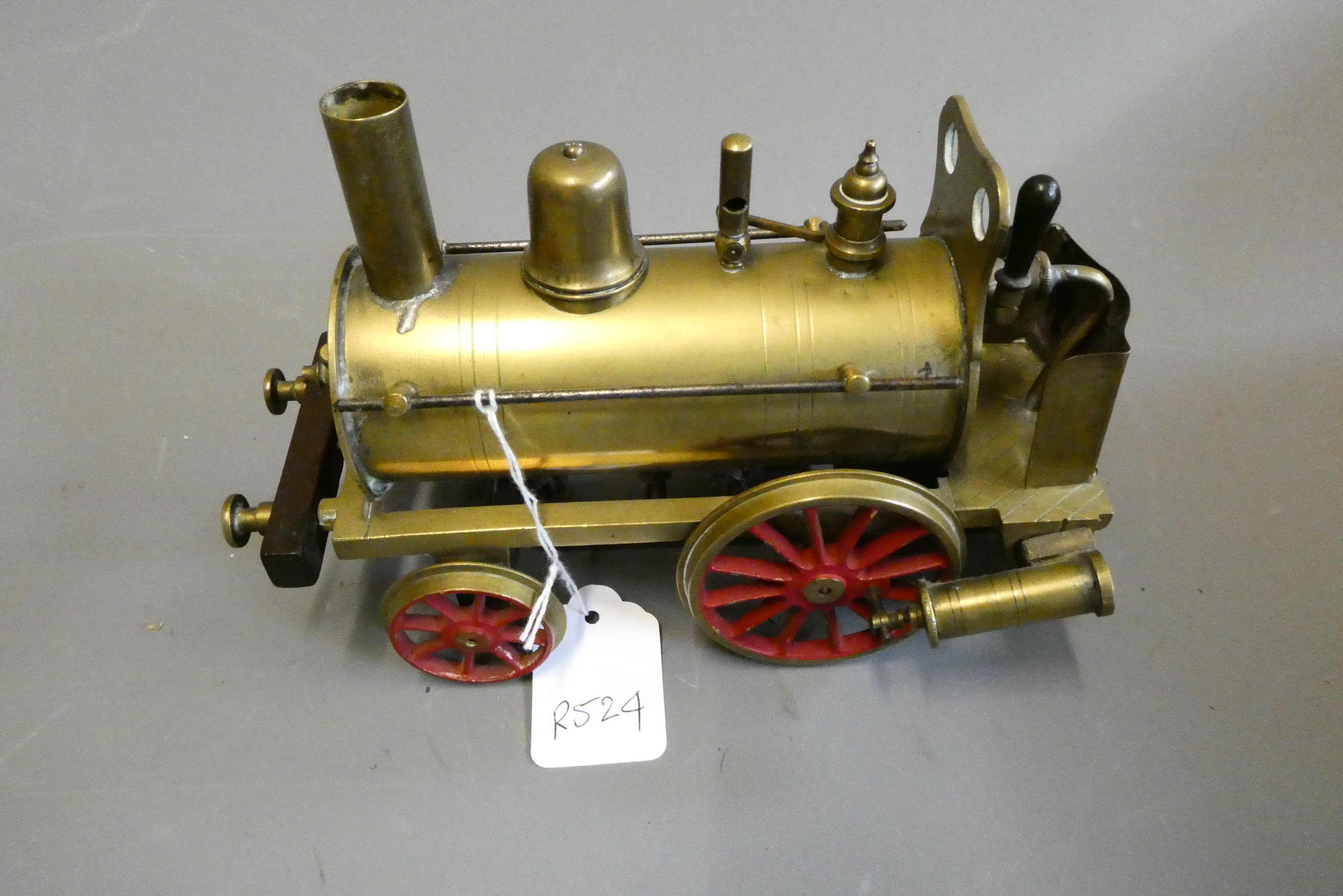 Brass Dribbler floor locomotive with twin oscillating cylinders, safety valve, whistle drain cock Image