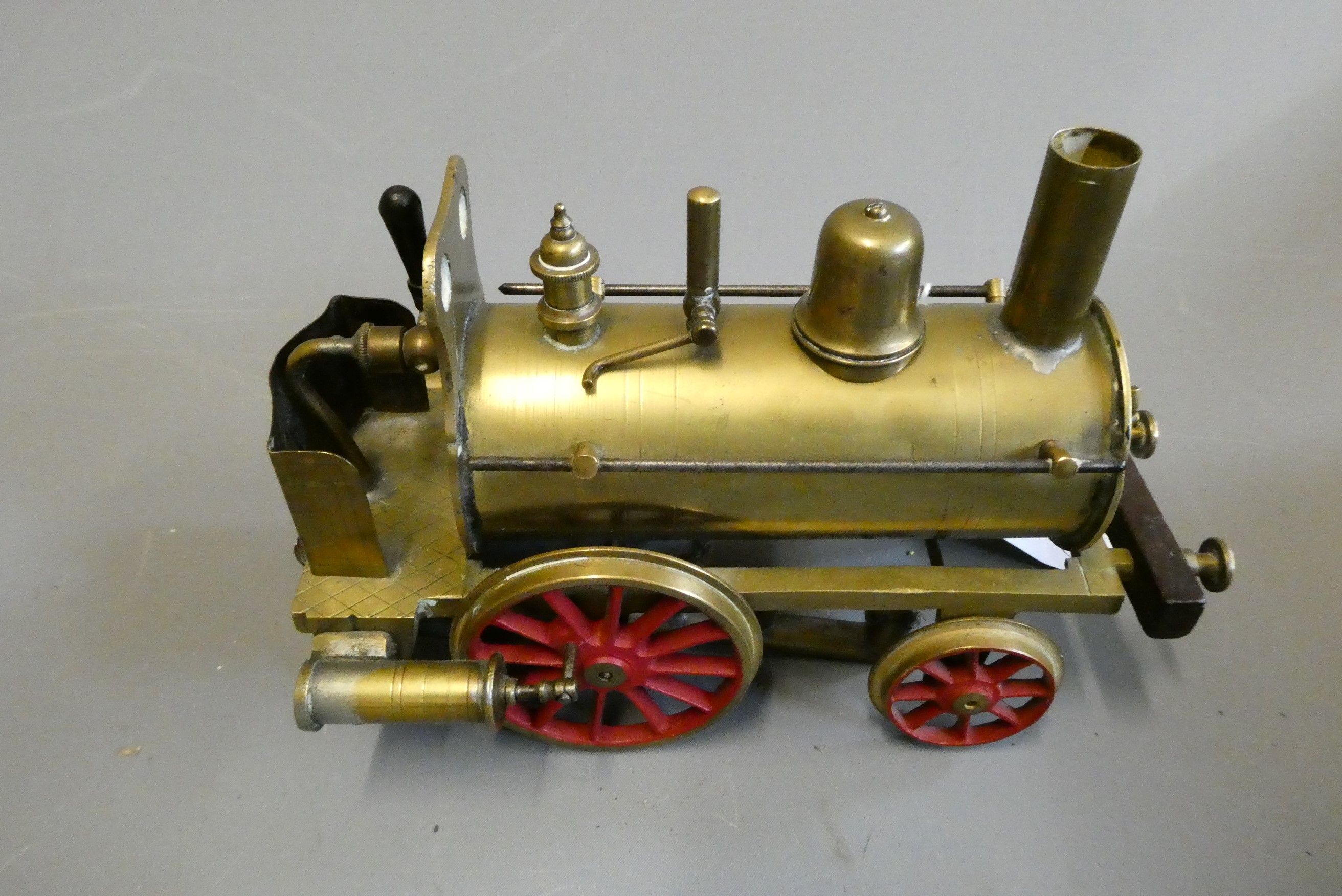 Brass Dribbler floor locomotive with twin oscillating cylinders, safety valve, whistle drain cock Image