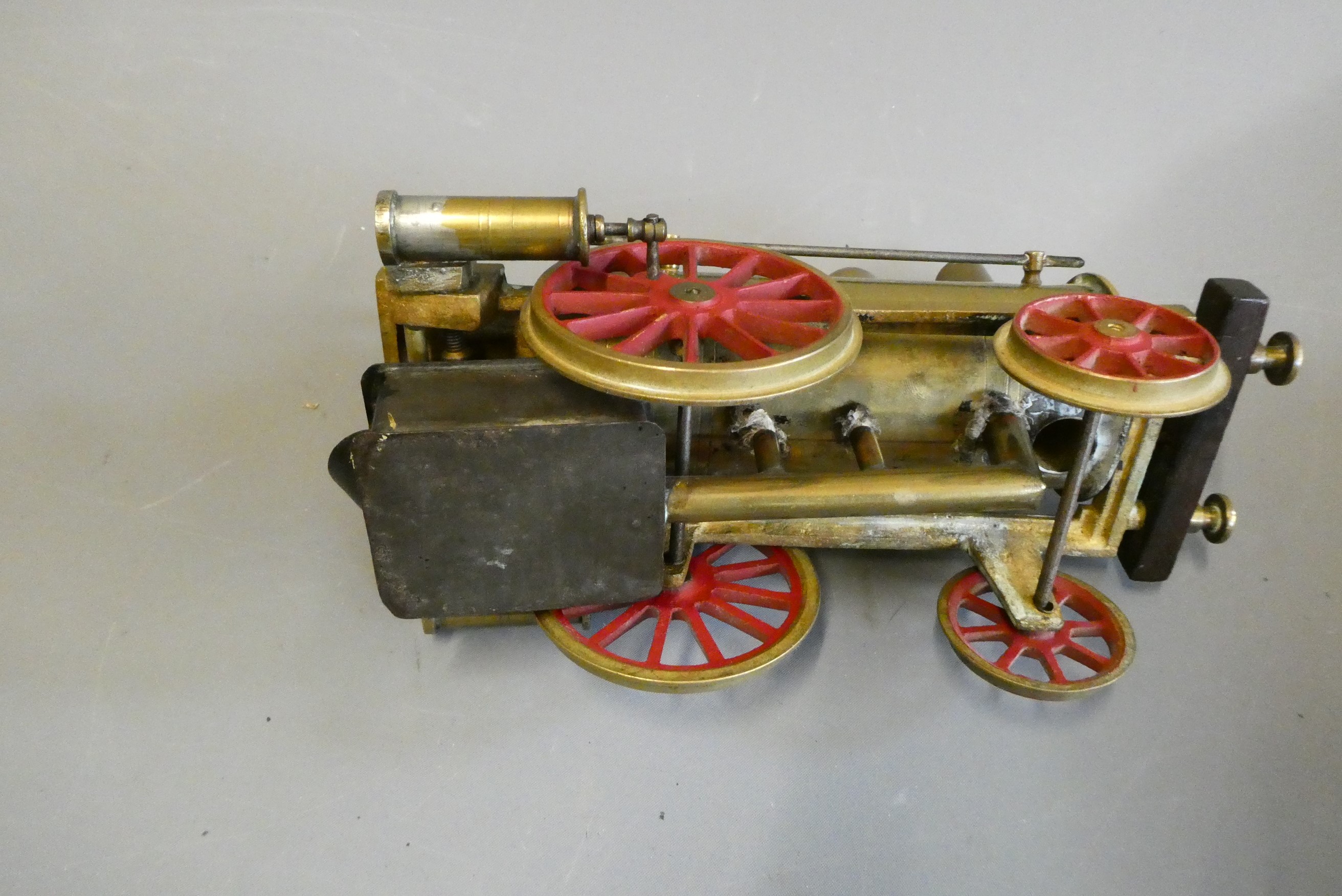 Brass Dribbler floor locomotive with twin oscillating cylinders, safety valve, whistle drain cock Image