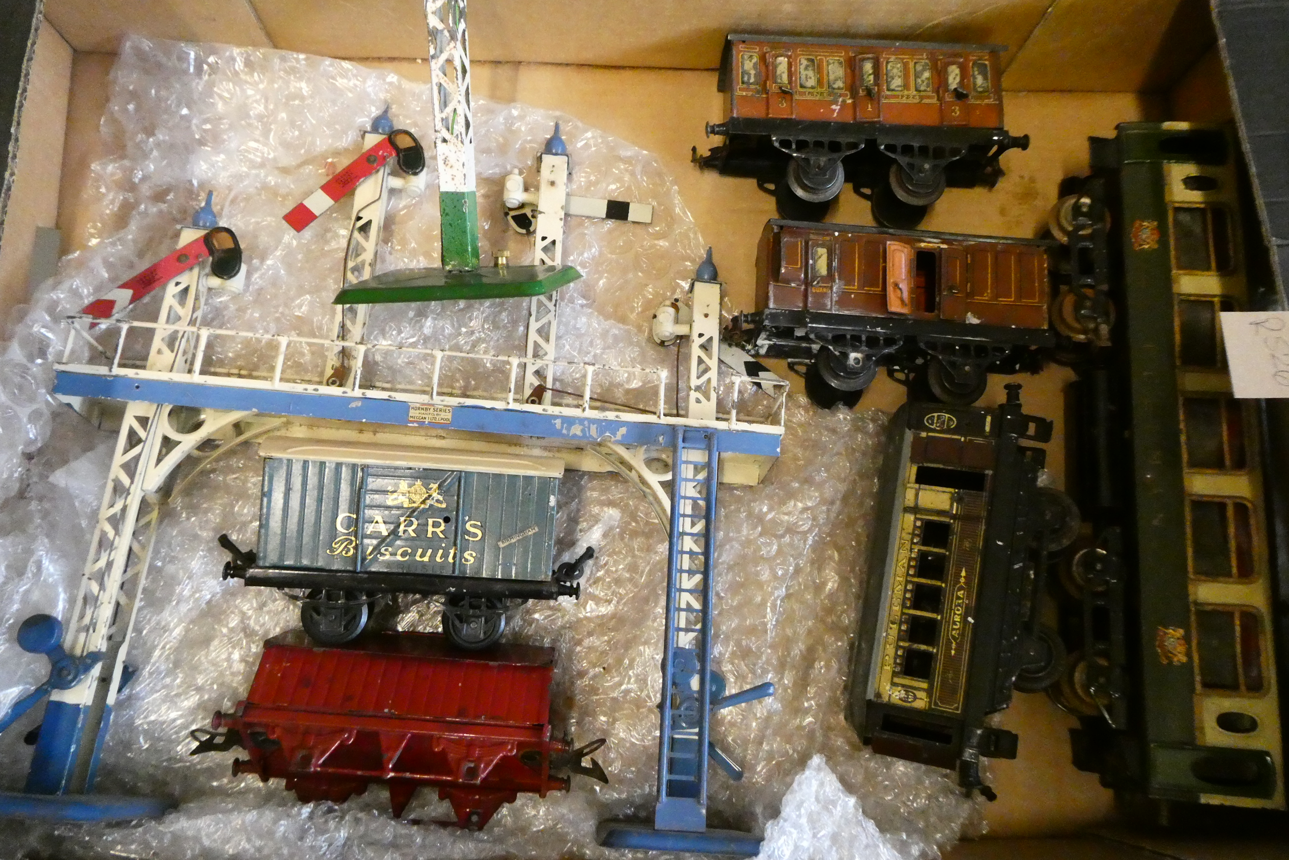 Hornby accessories including signal gantry, yard lamp, three good wagons, three passenger coaches Image