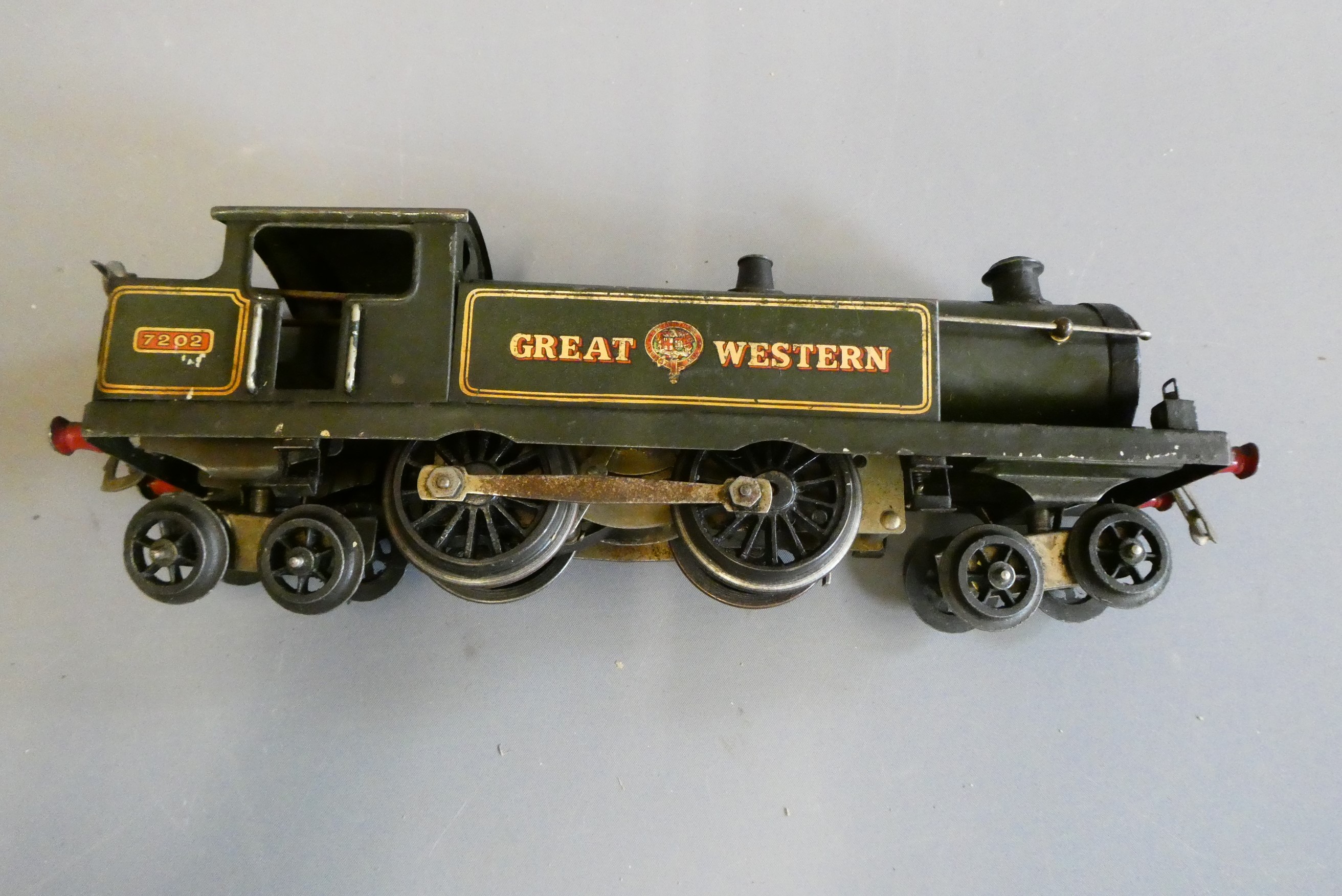 Hornby accessories including signal gantry, yard lamp, three good wagons, three passenger coaches Image