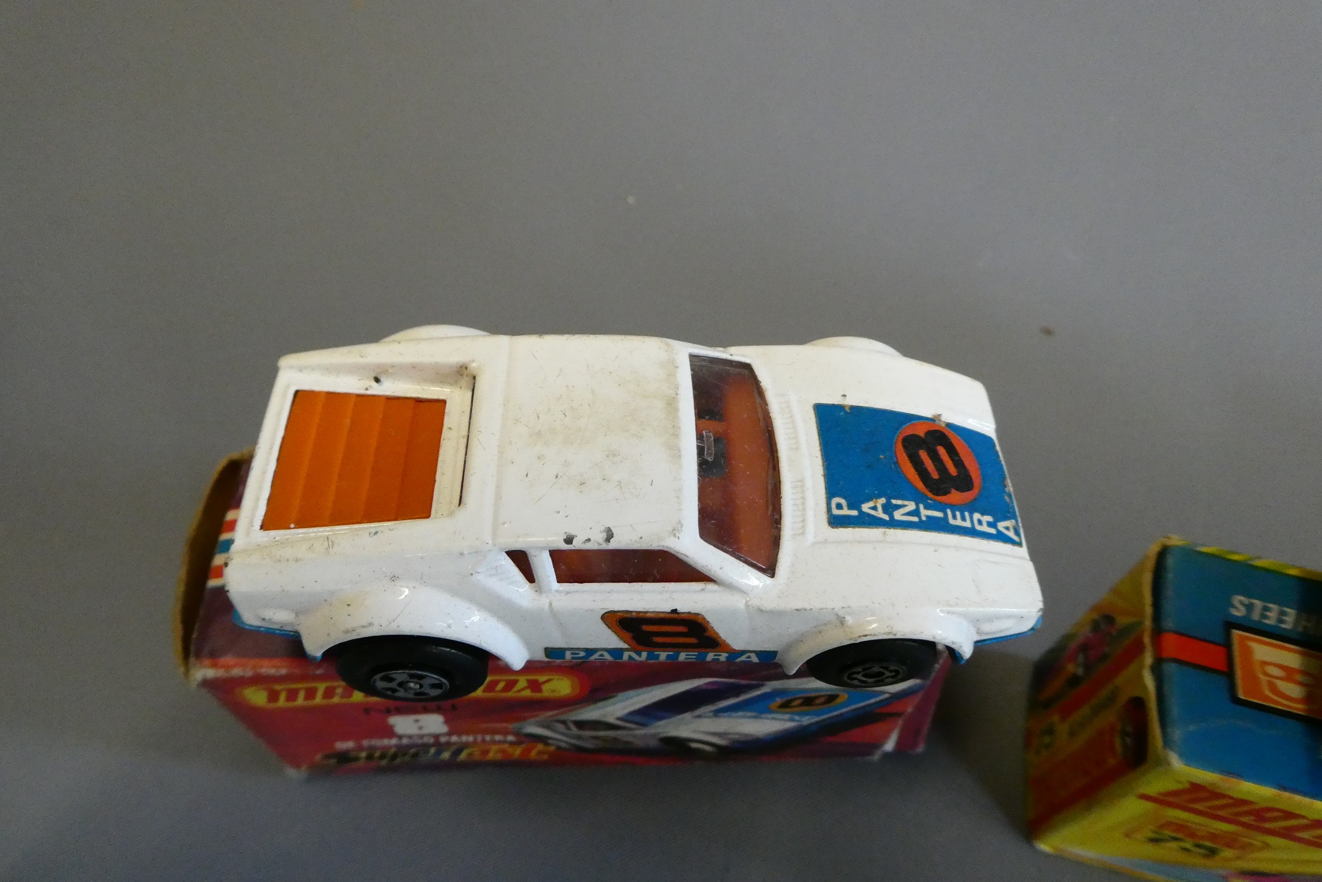Four Matchbox Superfast cars comprising No14 Mini Ha Ha, No8 De Tomaso Pantera, No 61 Blue Shark and Image