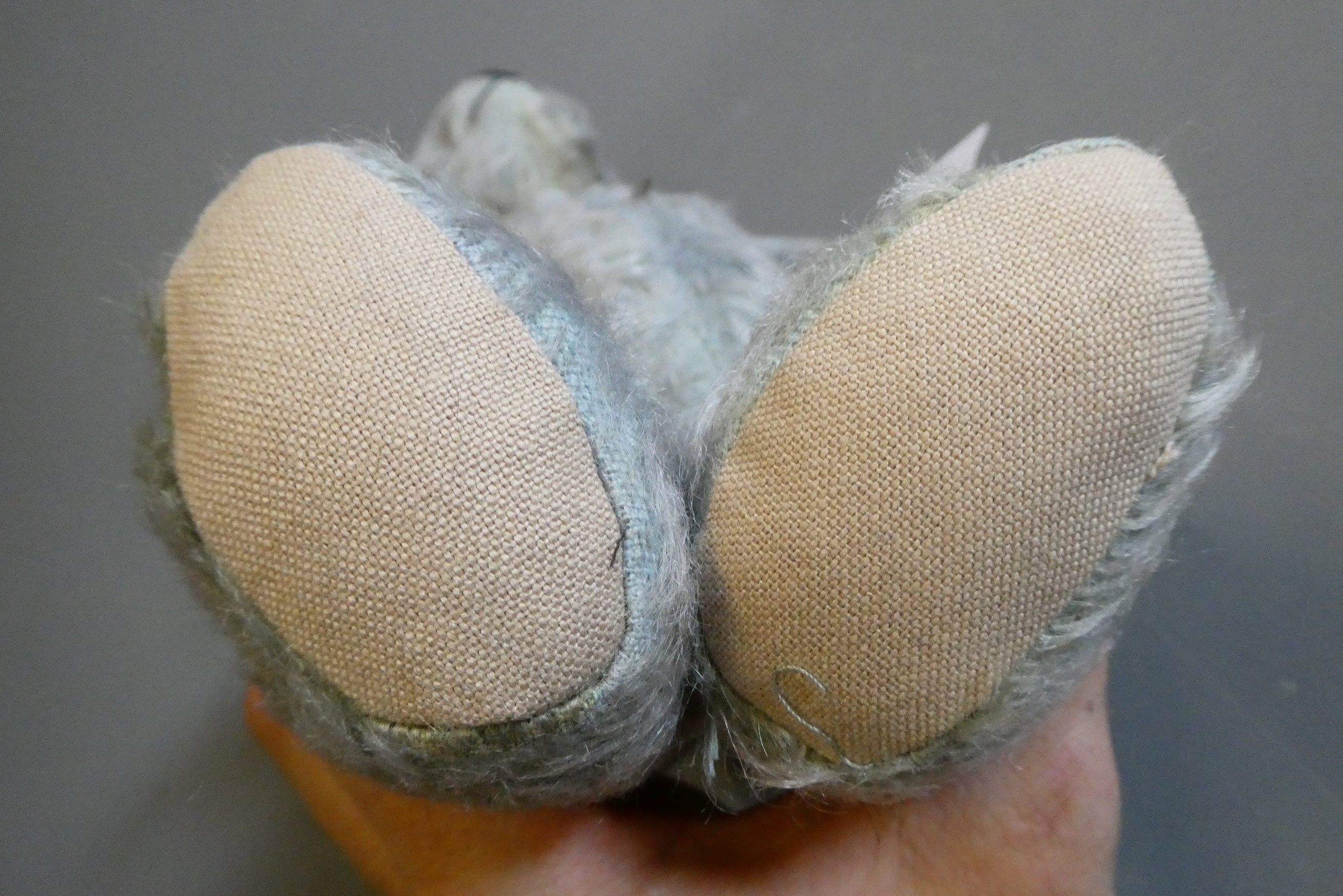 A rare blue Hugmee Chiltern teddy bear "bluey", with amber glass eyes, sewn nose and fabric pads, Image