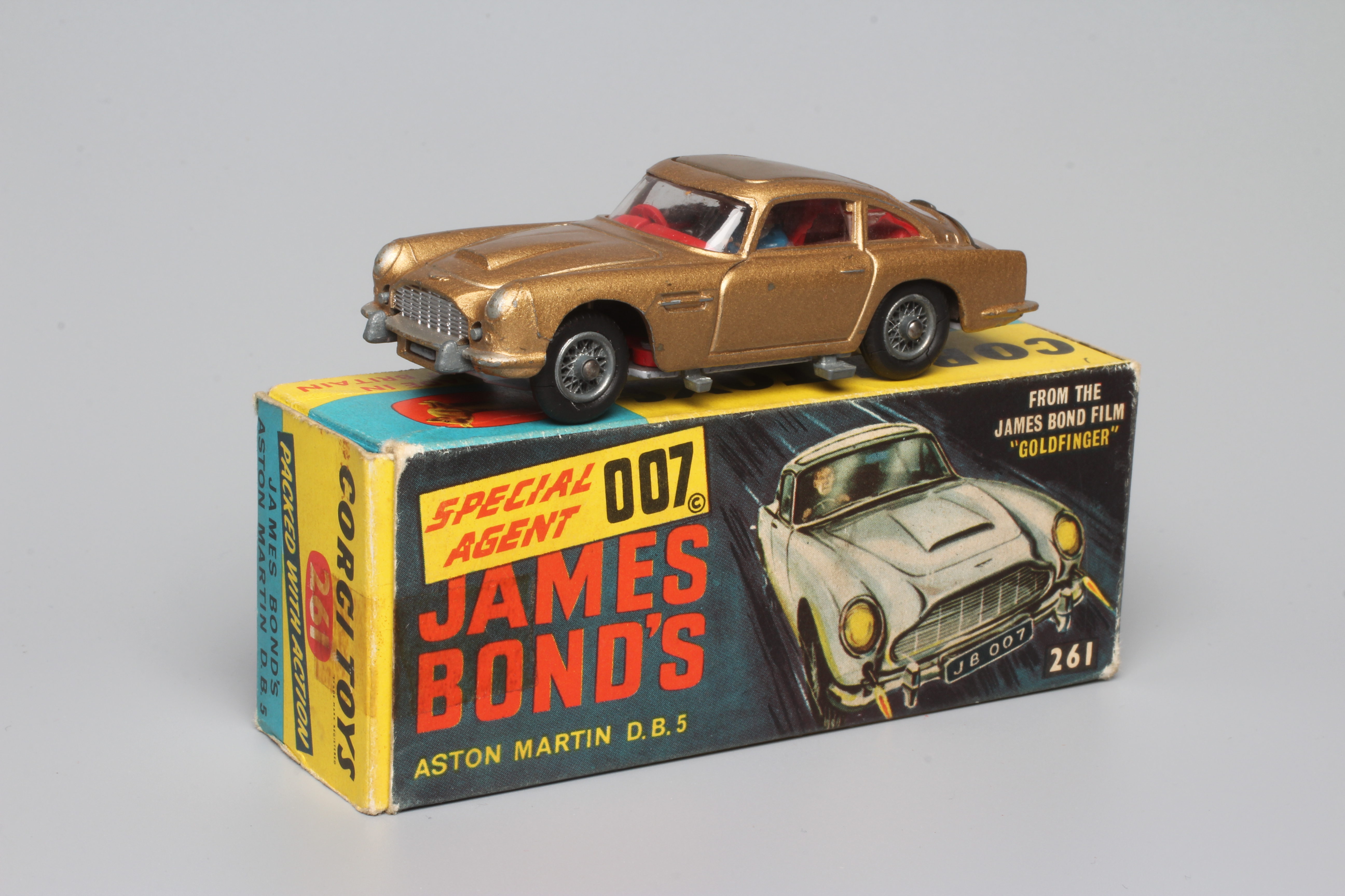 Corgi 261 James Bond Aston Martin DB5, first edition in gold with instructions and spare passenger. Image
