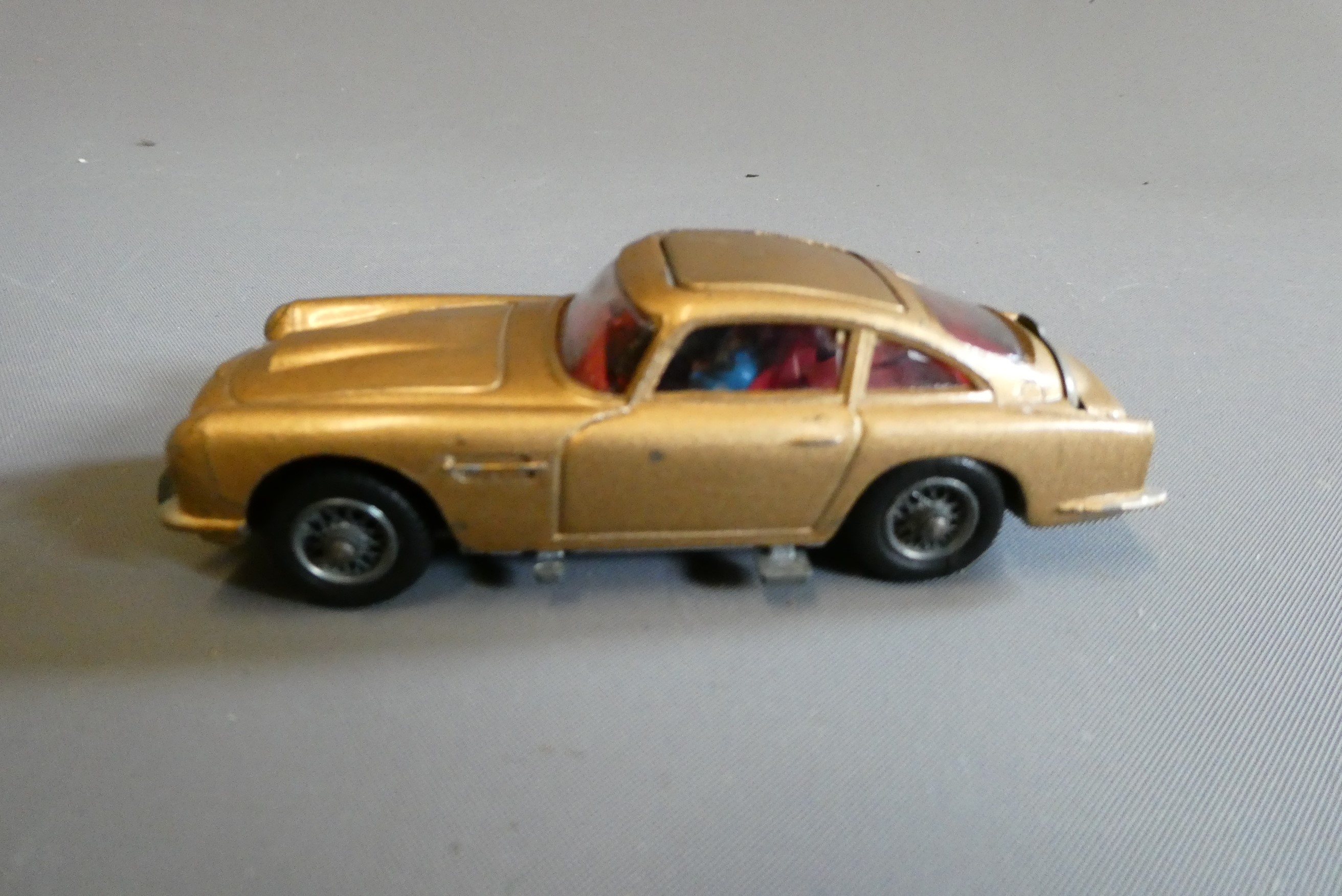 Corgi 261 James Bond Aston Martin DB5, first edition in gold with instructions and spare passenger. Image