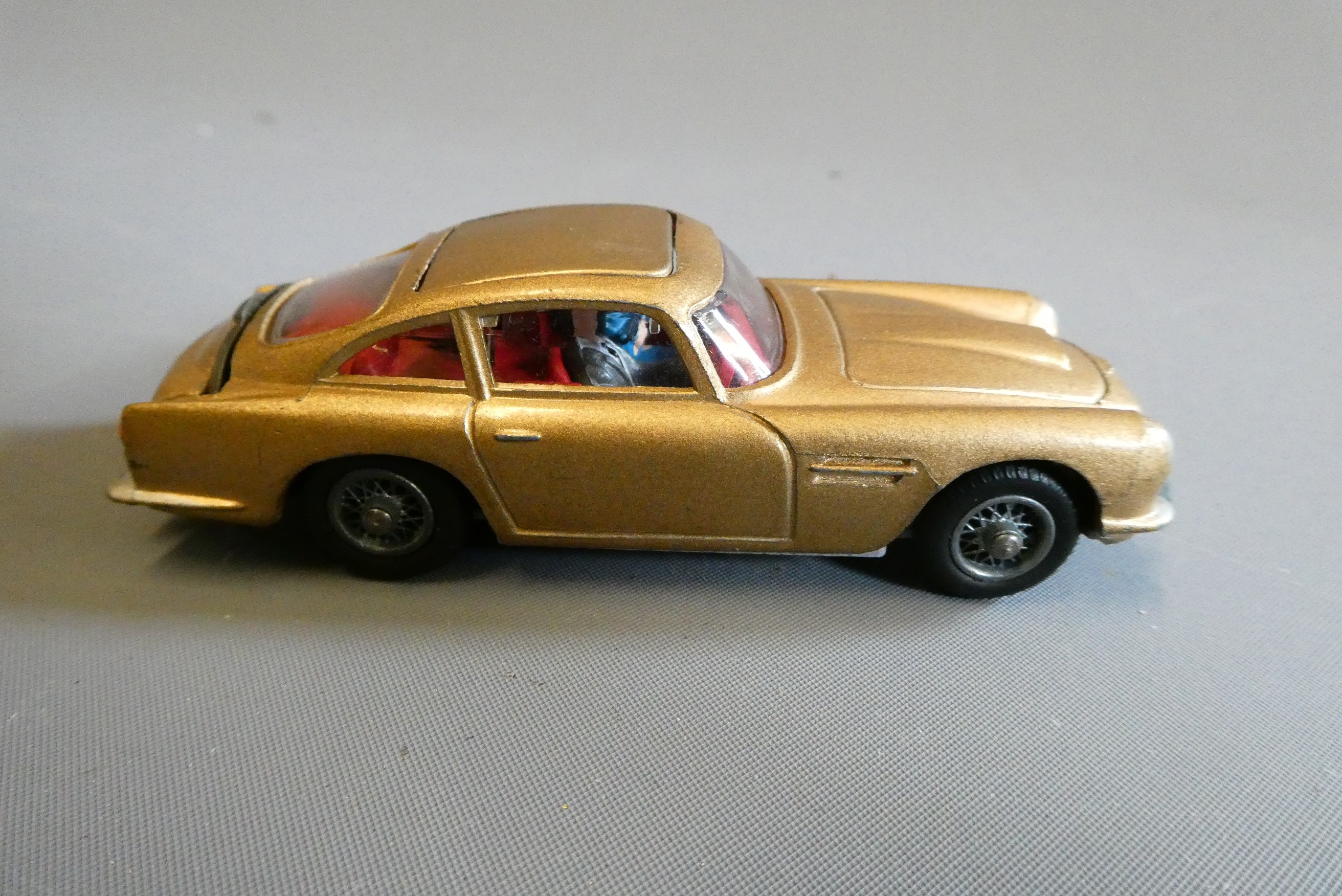 Corgi 261 James Bond Aston Martin DB5, first edition in gold with instructions and spare passenger. Image