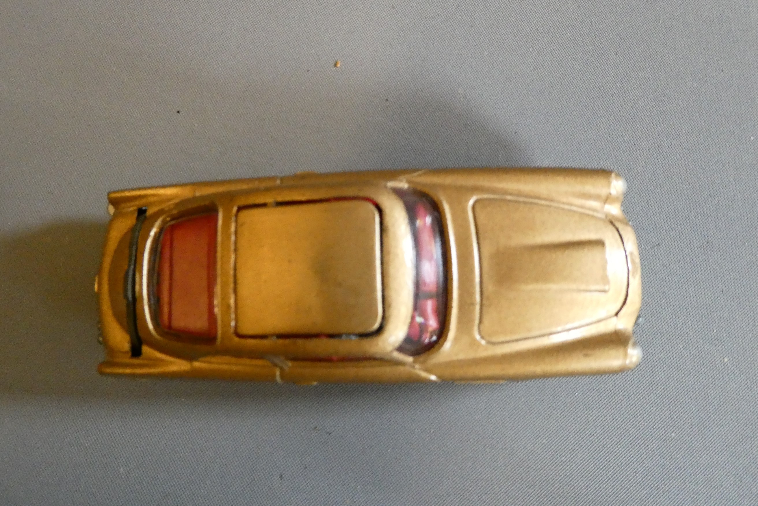 Corgi 261 James Bond Aston Martin DB5, first edition in gold with instructions and spare passenger. Image